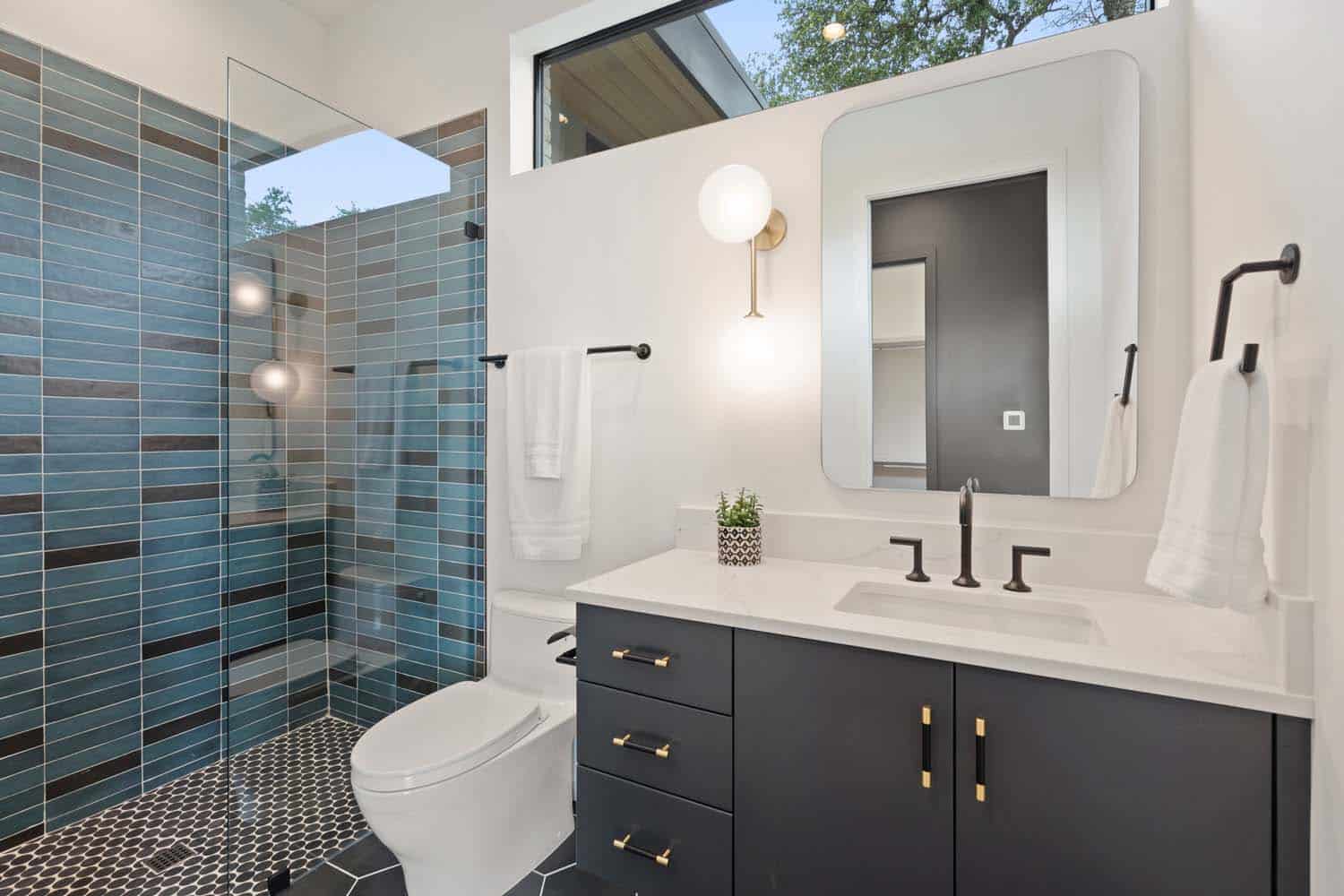 modern bathroom with a glass enclosed shower