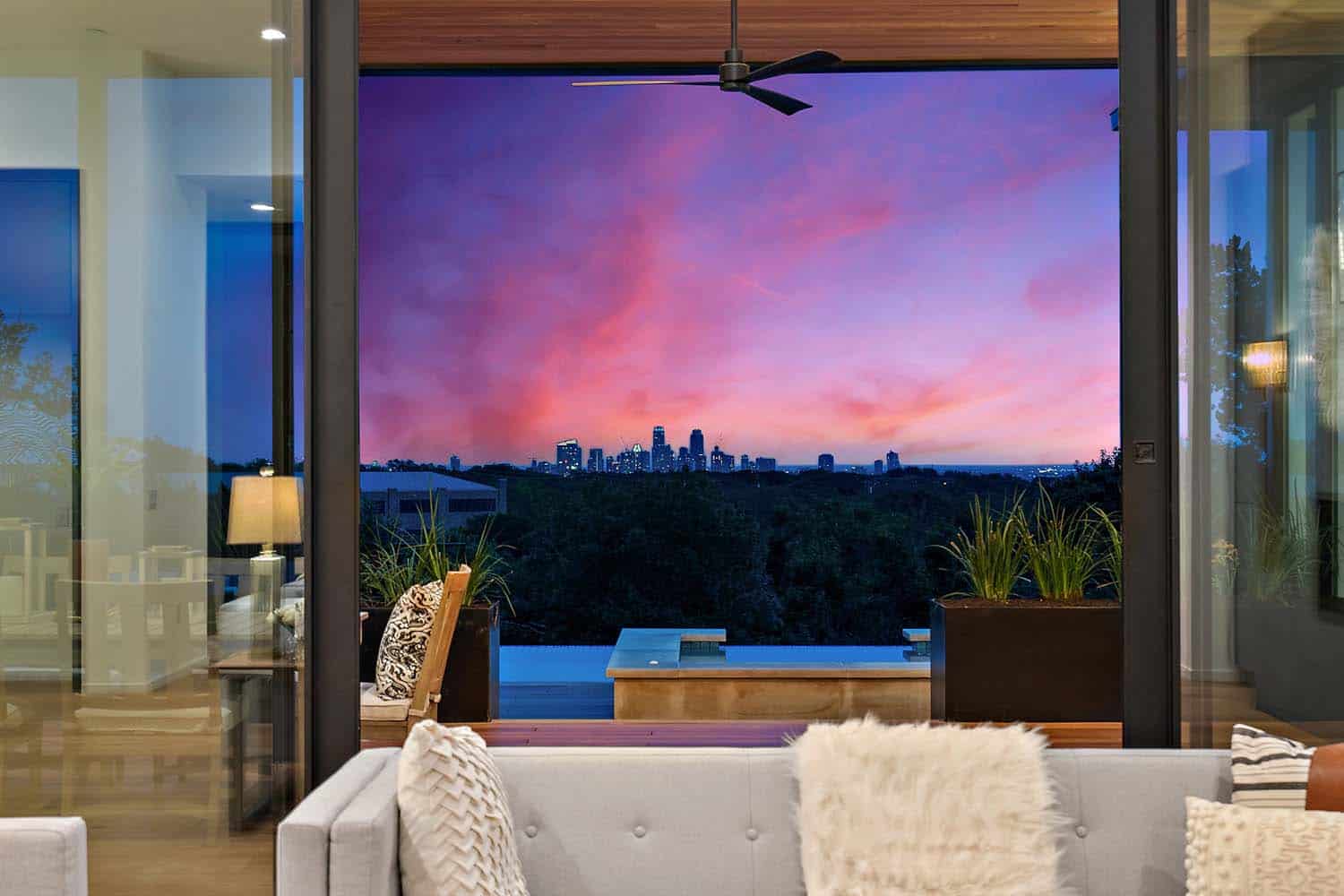 modern living room with a view to the pool at dusk
