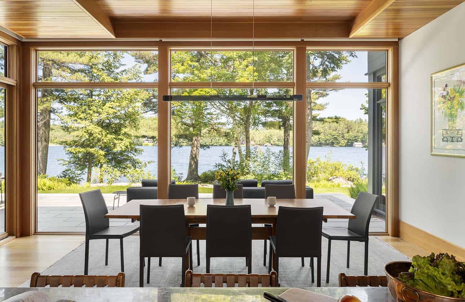 modern dining room with a view of the lake