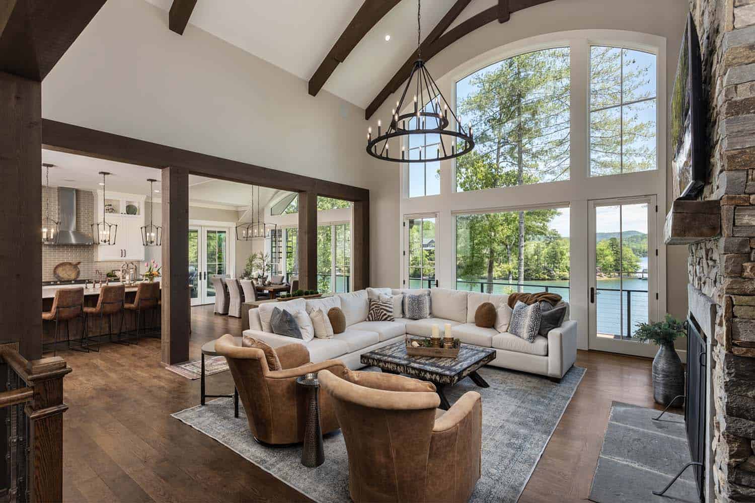 rustic living room with tall ceilings and a large window