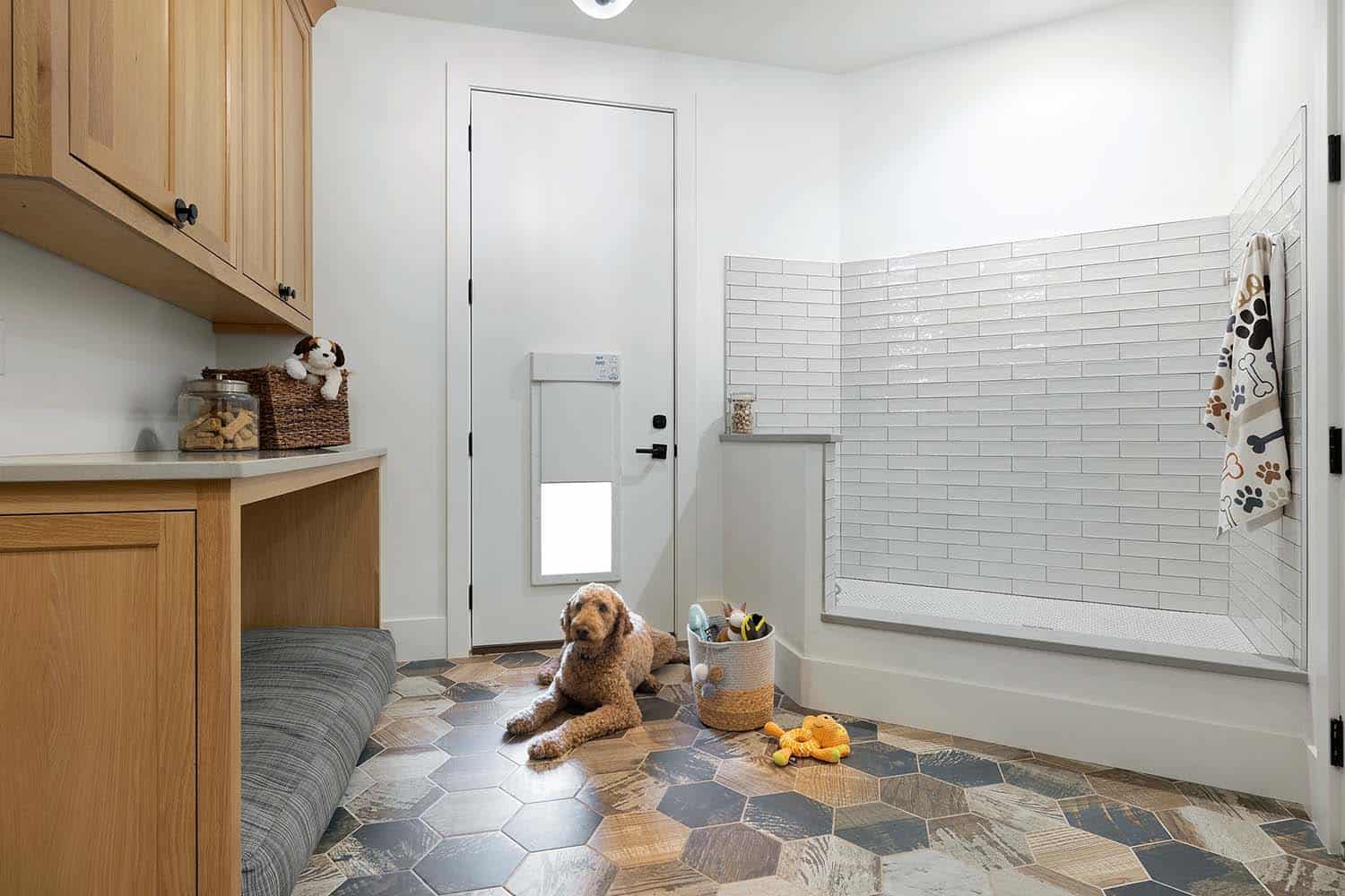 rustic mudroom with a dog door and integrated dog bed