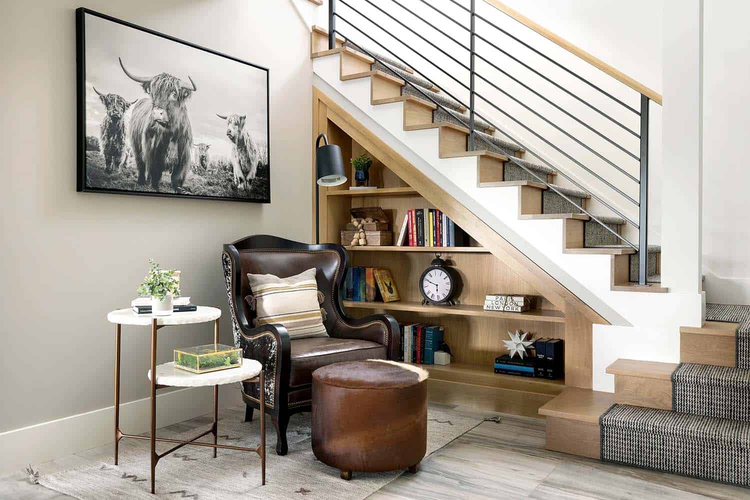 rustic staircase with an integrated bookcase leading into the basement level
