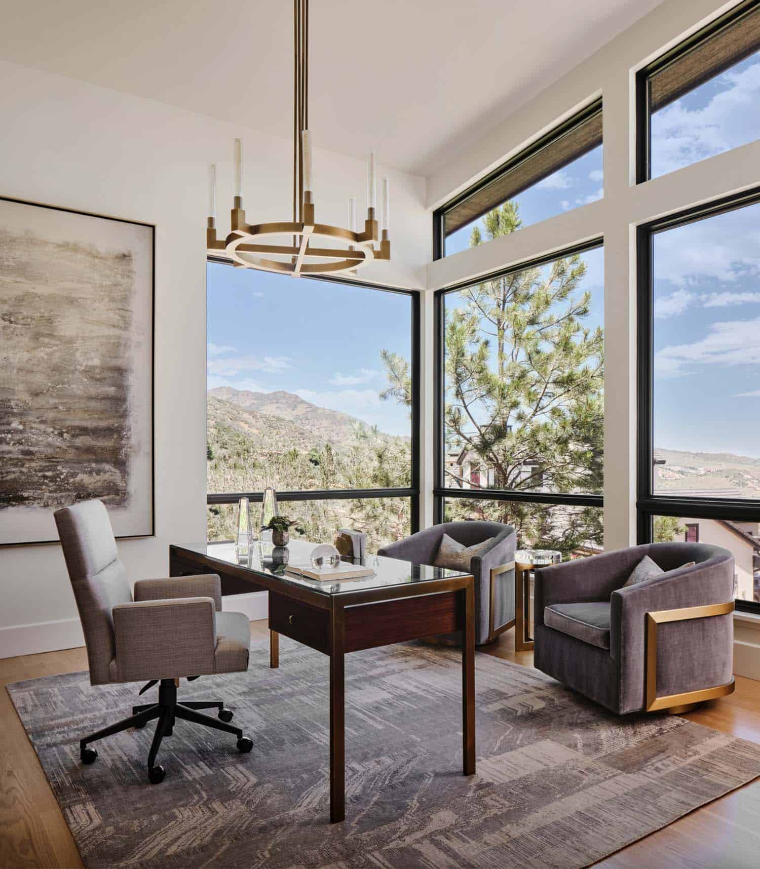 modern home office with large windows and mountain views