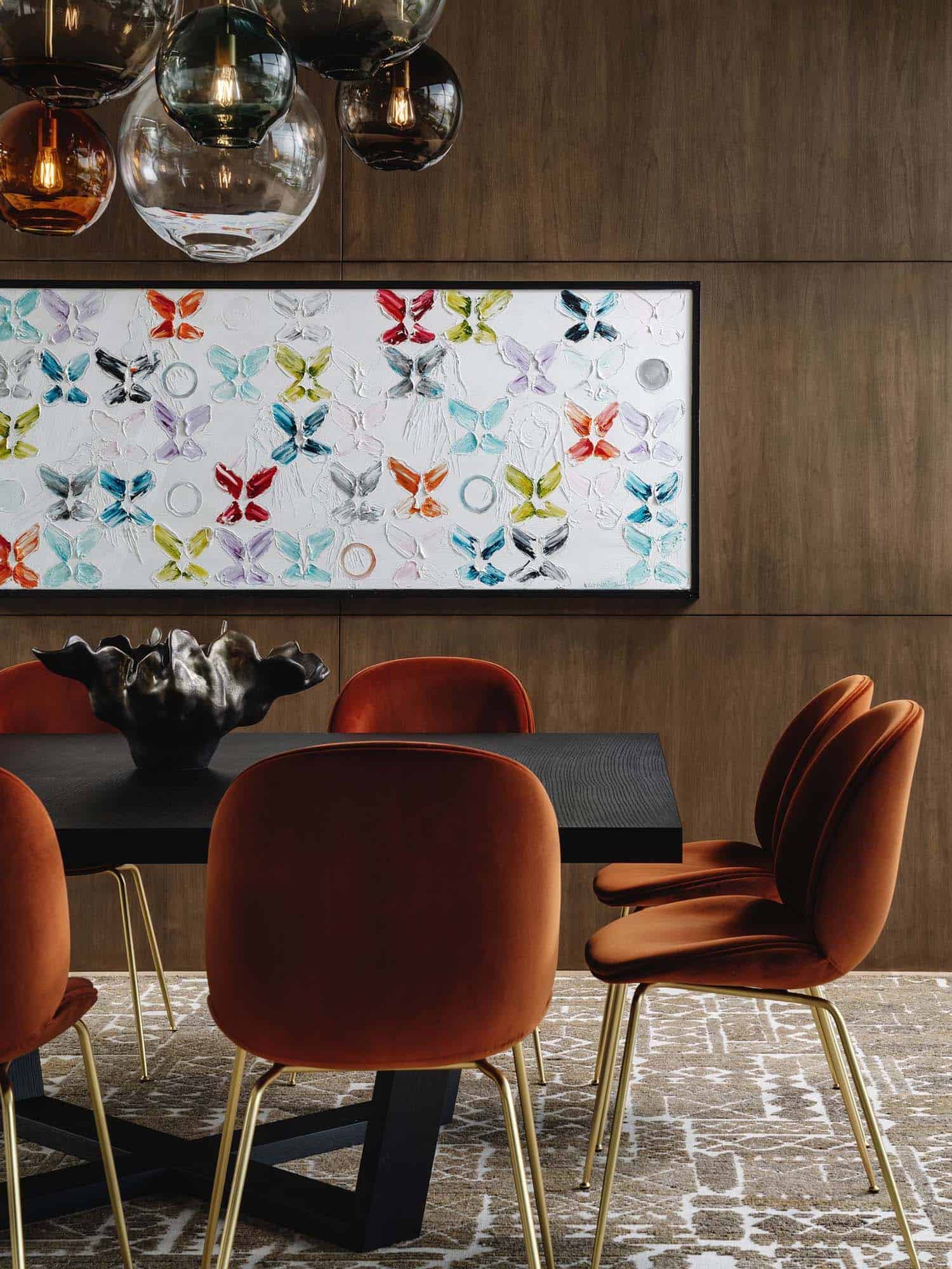 modern dining room with butterfly wall art