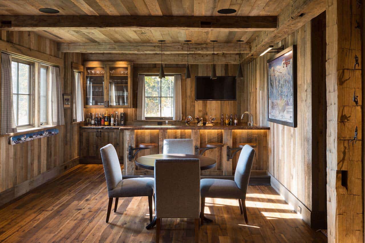 rustic mountain style home bar with a casual dining area