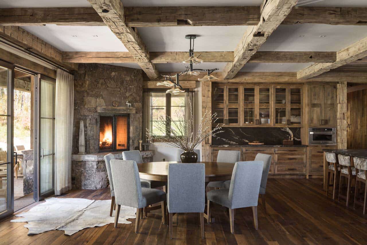 rustic mountain style dining room with a fireplace