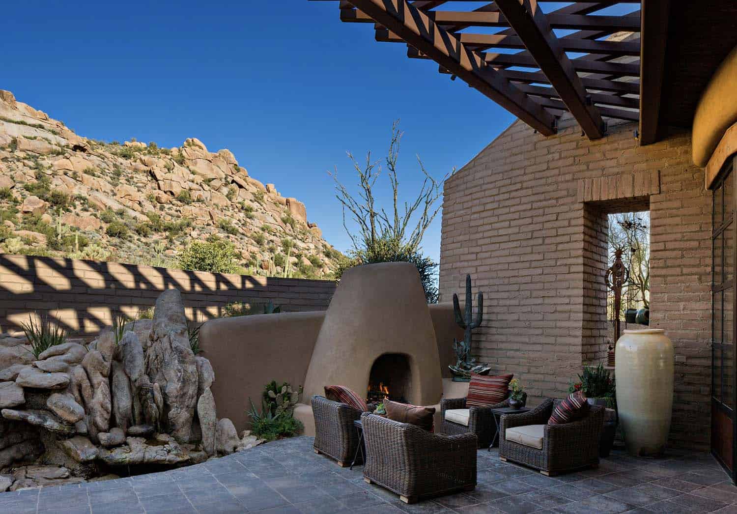 southwestern style courtyard with a fireplace