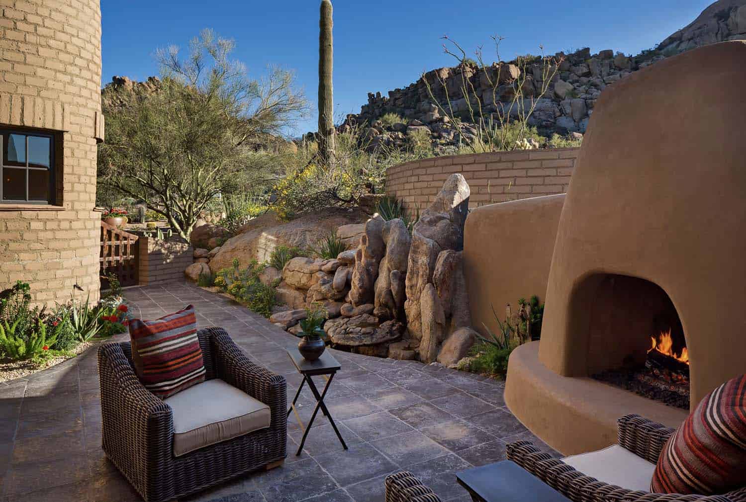 southwestern style courtyard with a fireplace