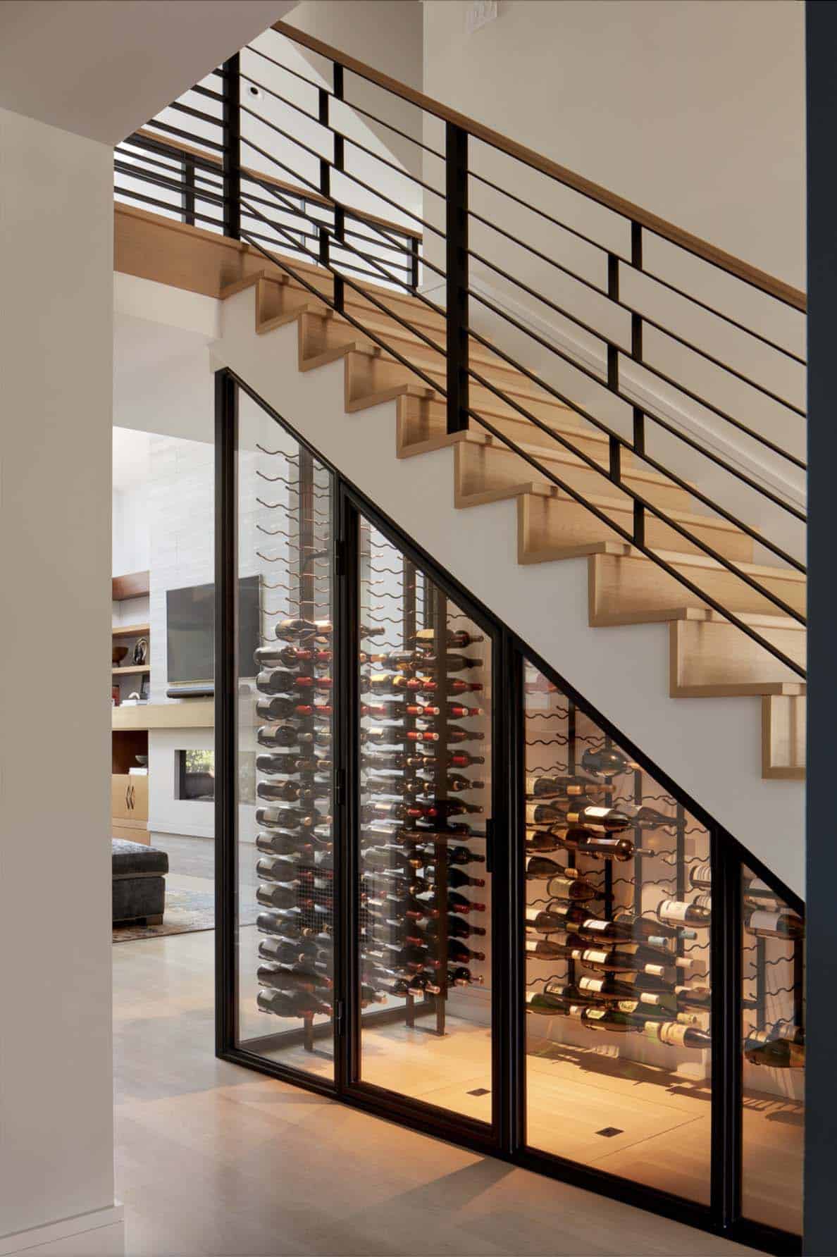 transitional home staircase with a built-in wine cellar