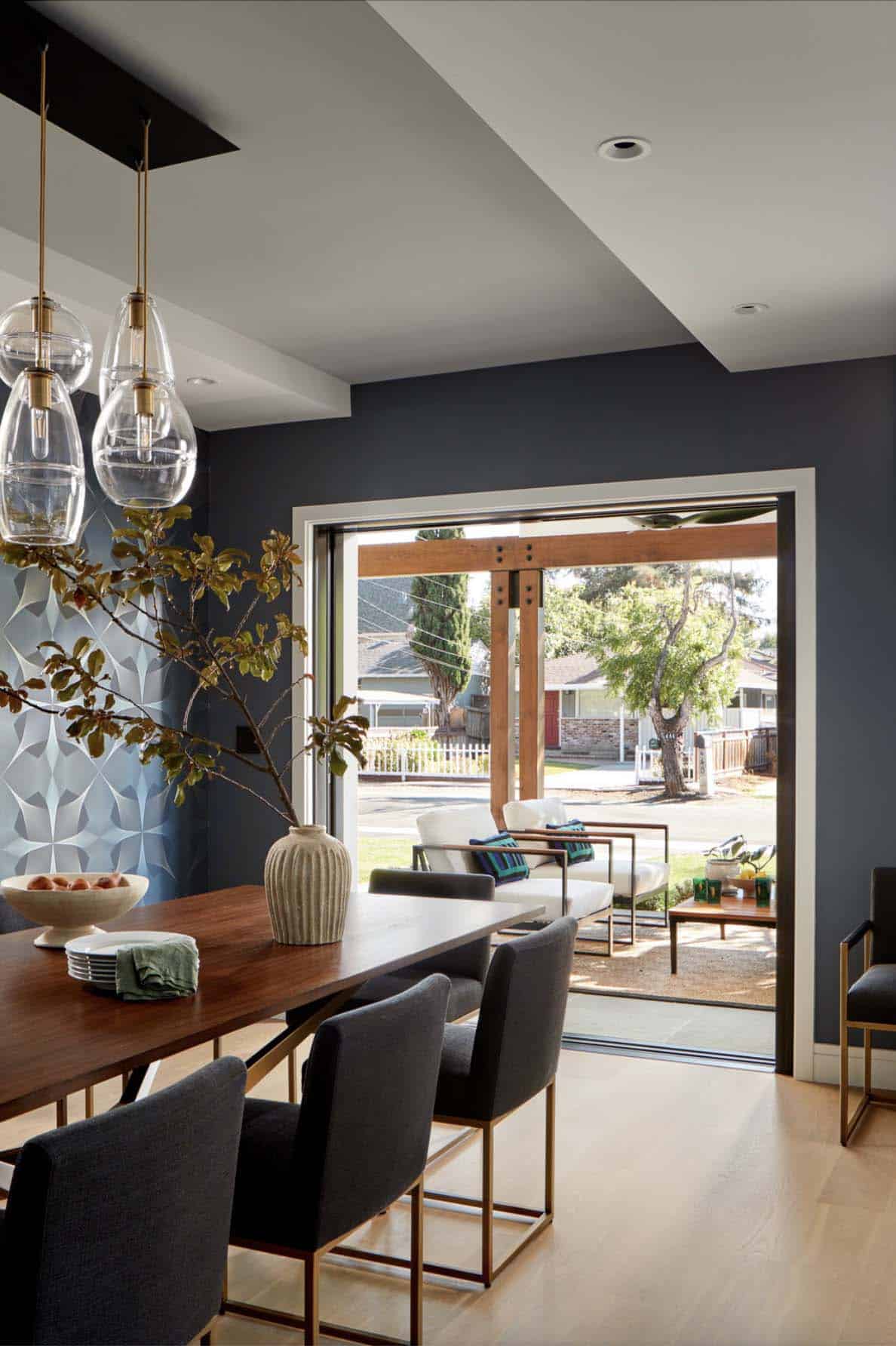 transitional dining room with sliding glass doors leading to the backyard patio