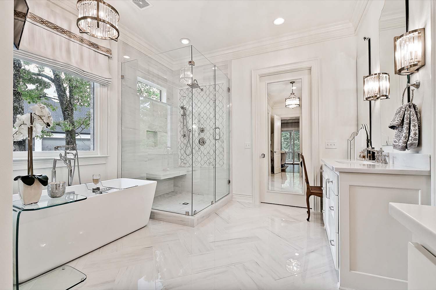 transitional style bathroom with a soaking tub and glass enclosed shower