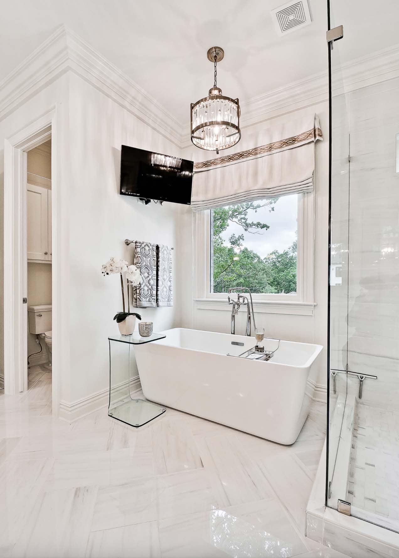 transitional style bathroom with a soaking tub