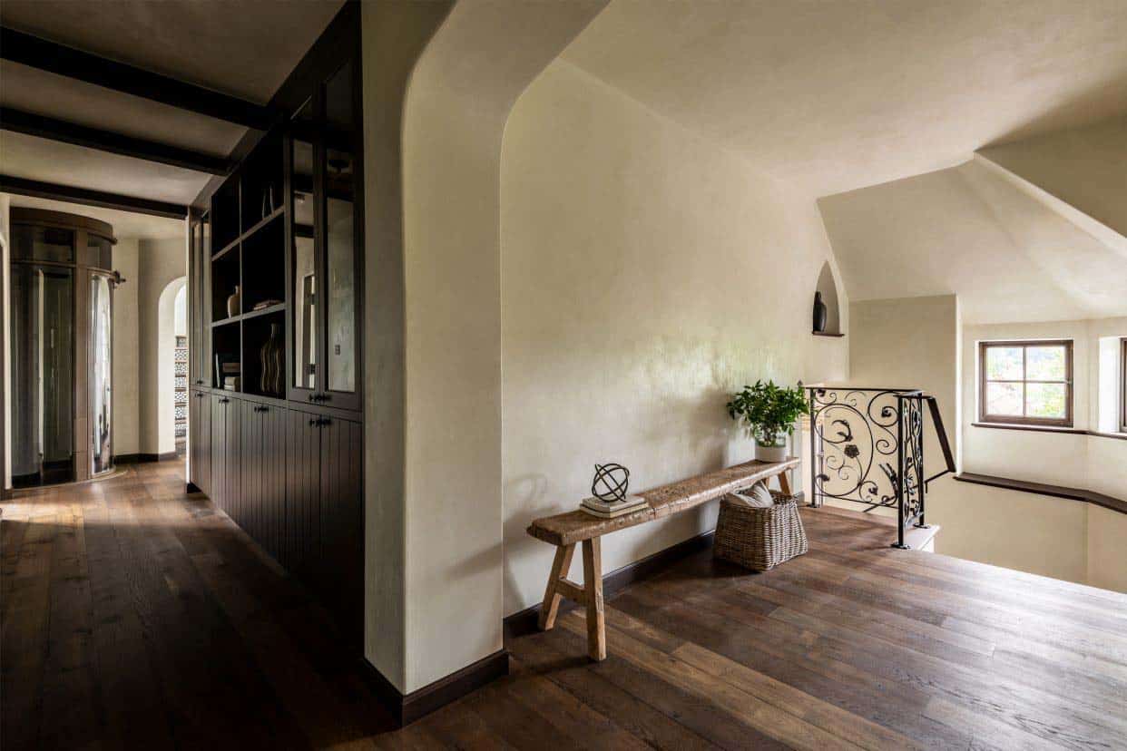 tudor style hallway with a wood bench