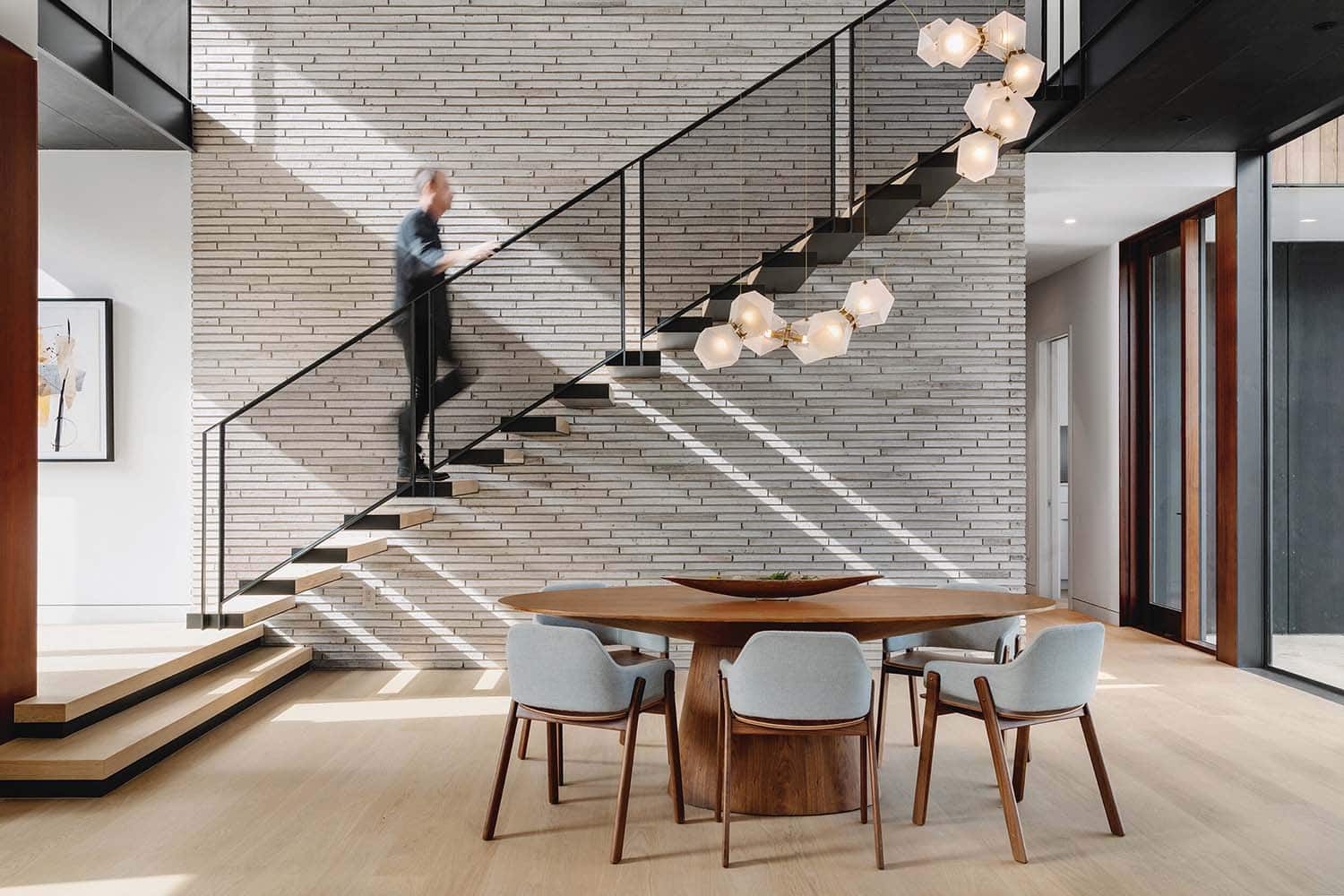 modern dining room with the staircase in the background