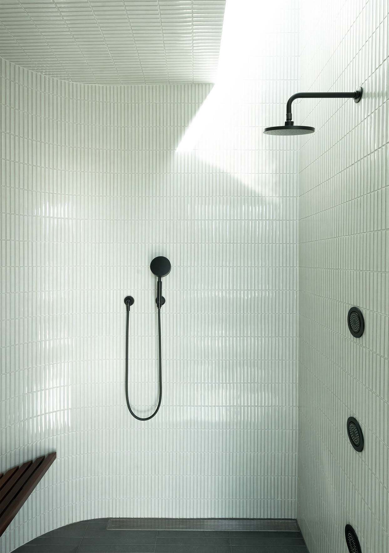 modern bathroom shower with white tiles
