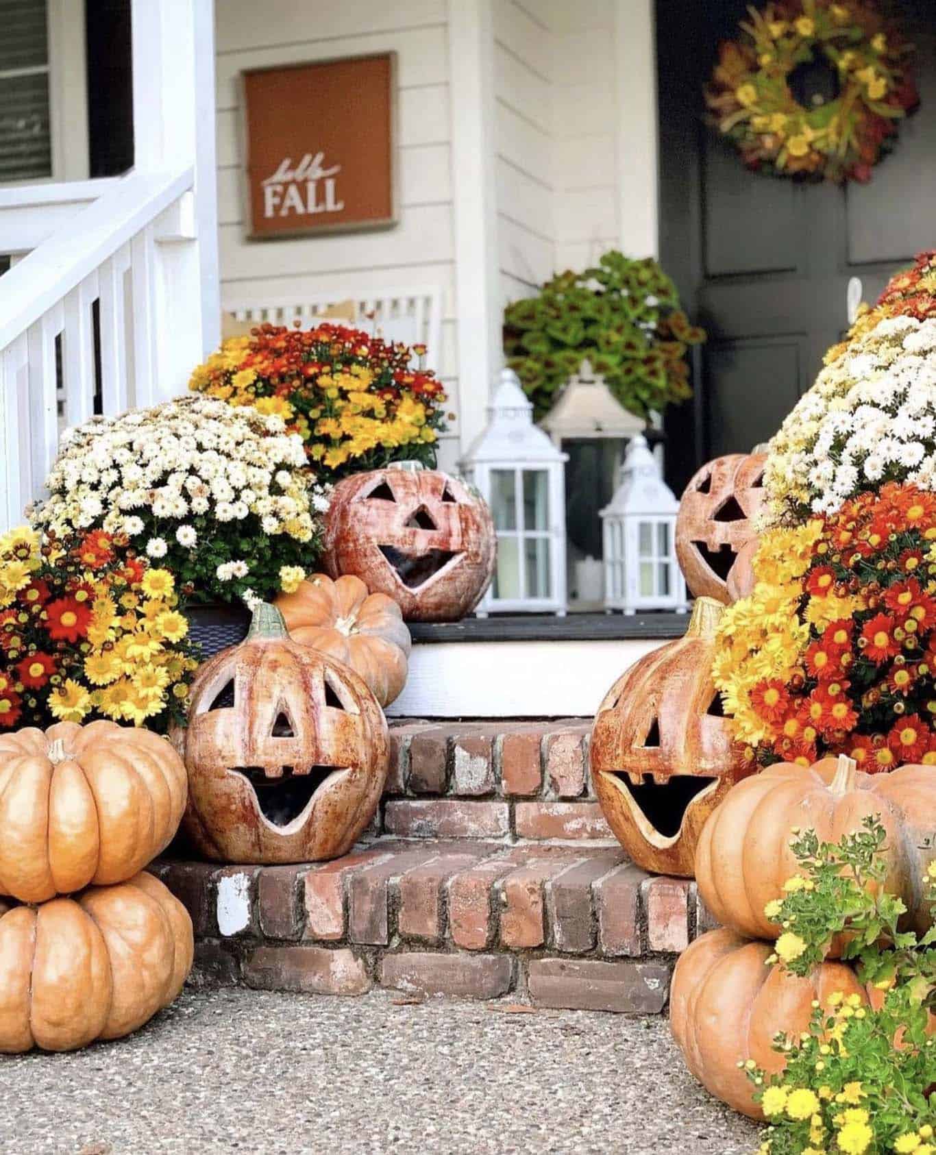 hello fall welcoming front porch with pumpkins and mums on the steps