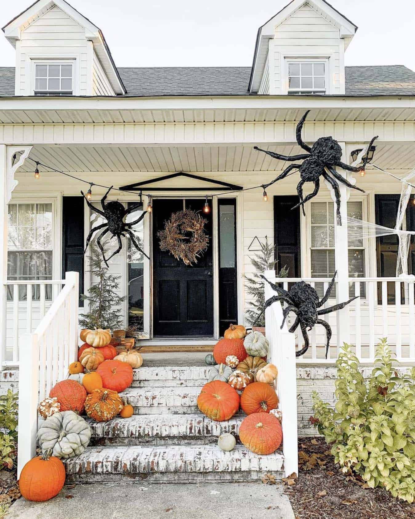 pumpkins and spiders on the front fall porch