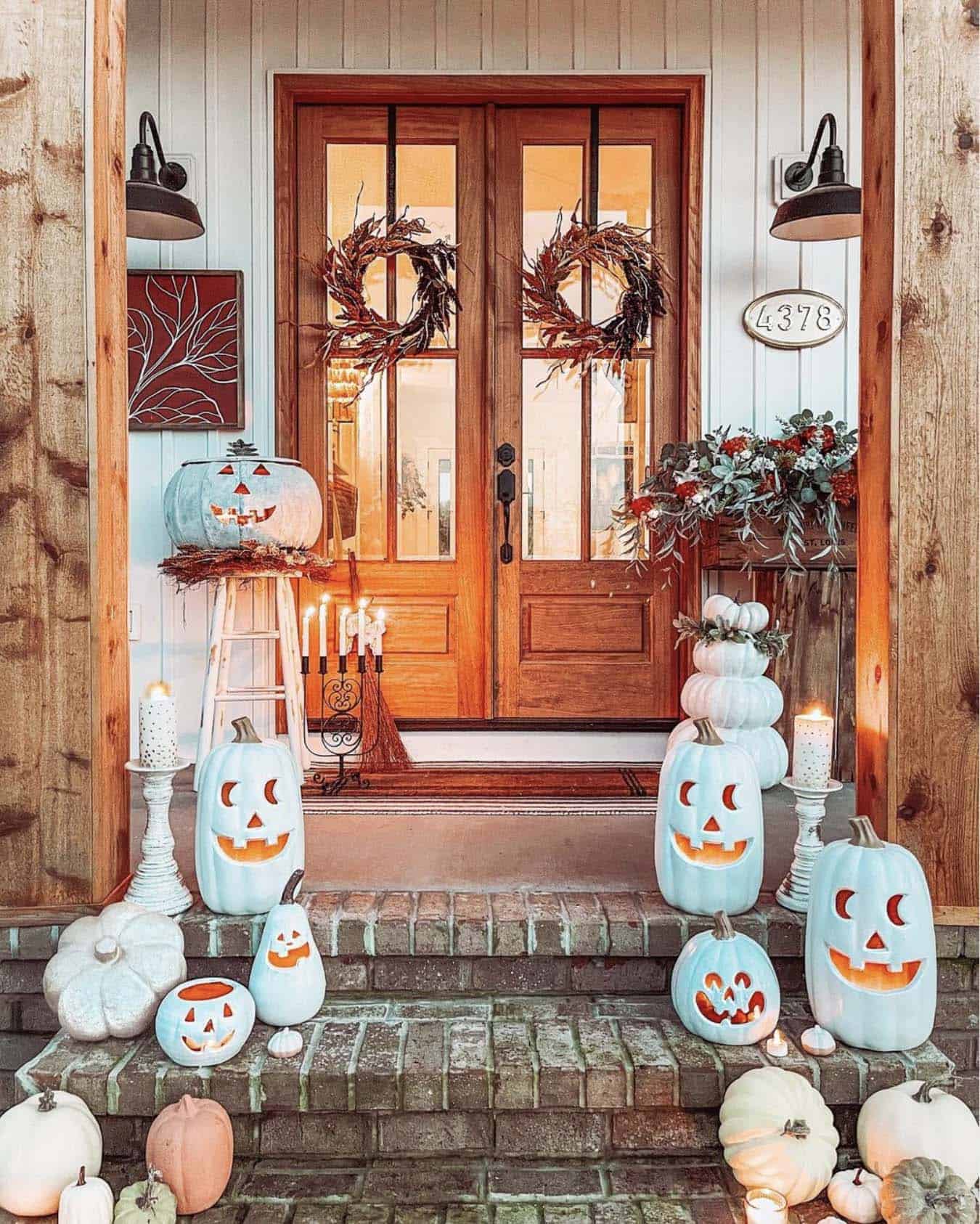 farmhouse style front porch with stylish white pumpkins