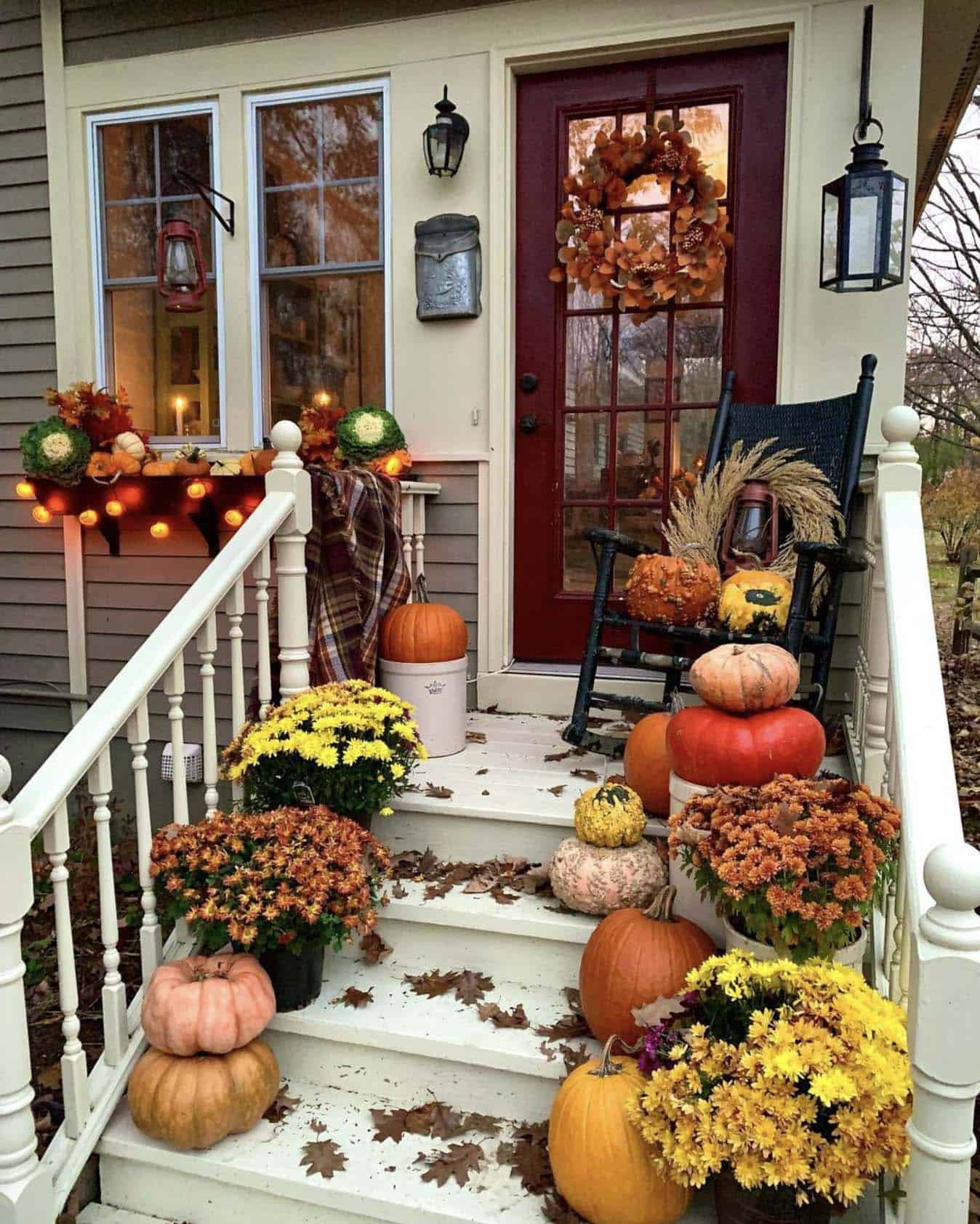 fall front porch with pumpkins and mums