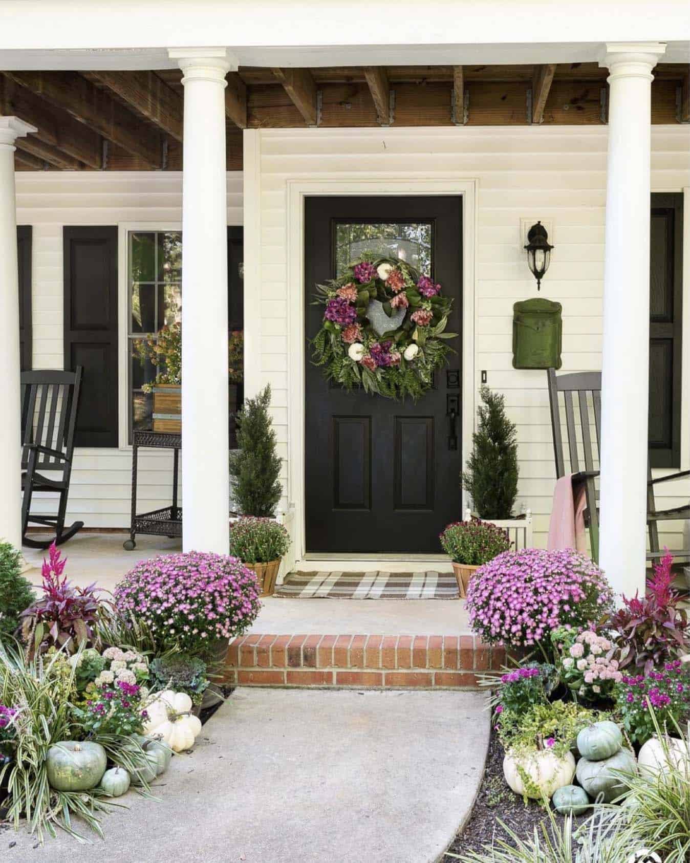 fuchsia and purple fall porch with a DIY wreath