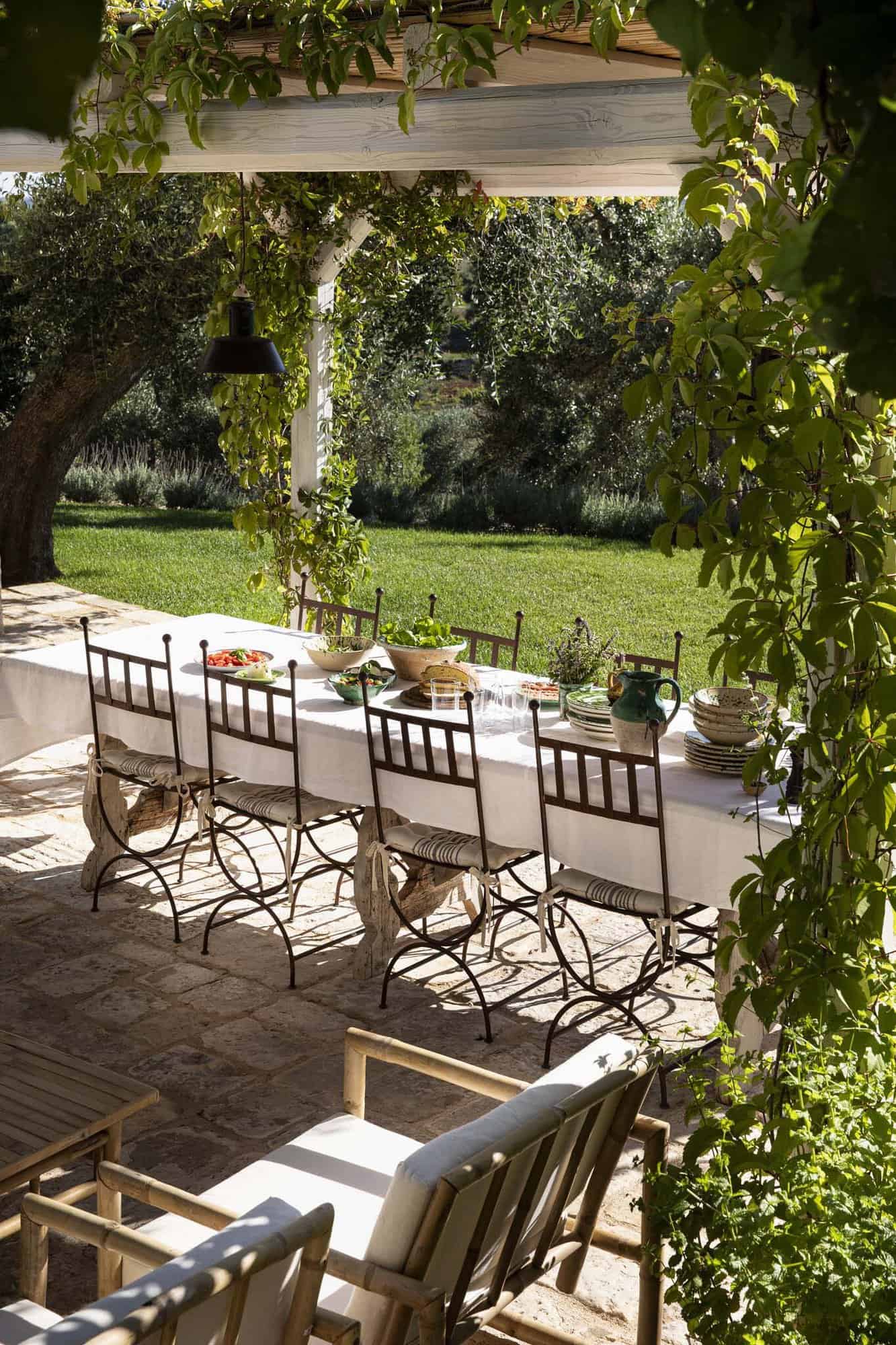 rustic patio with an outdoor dining table