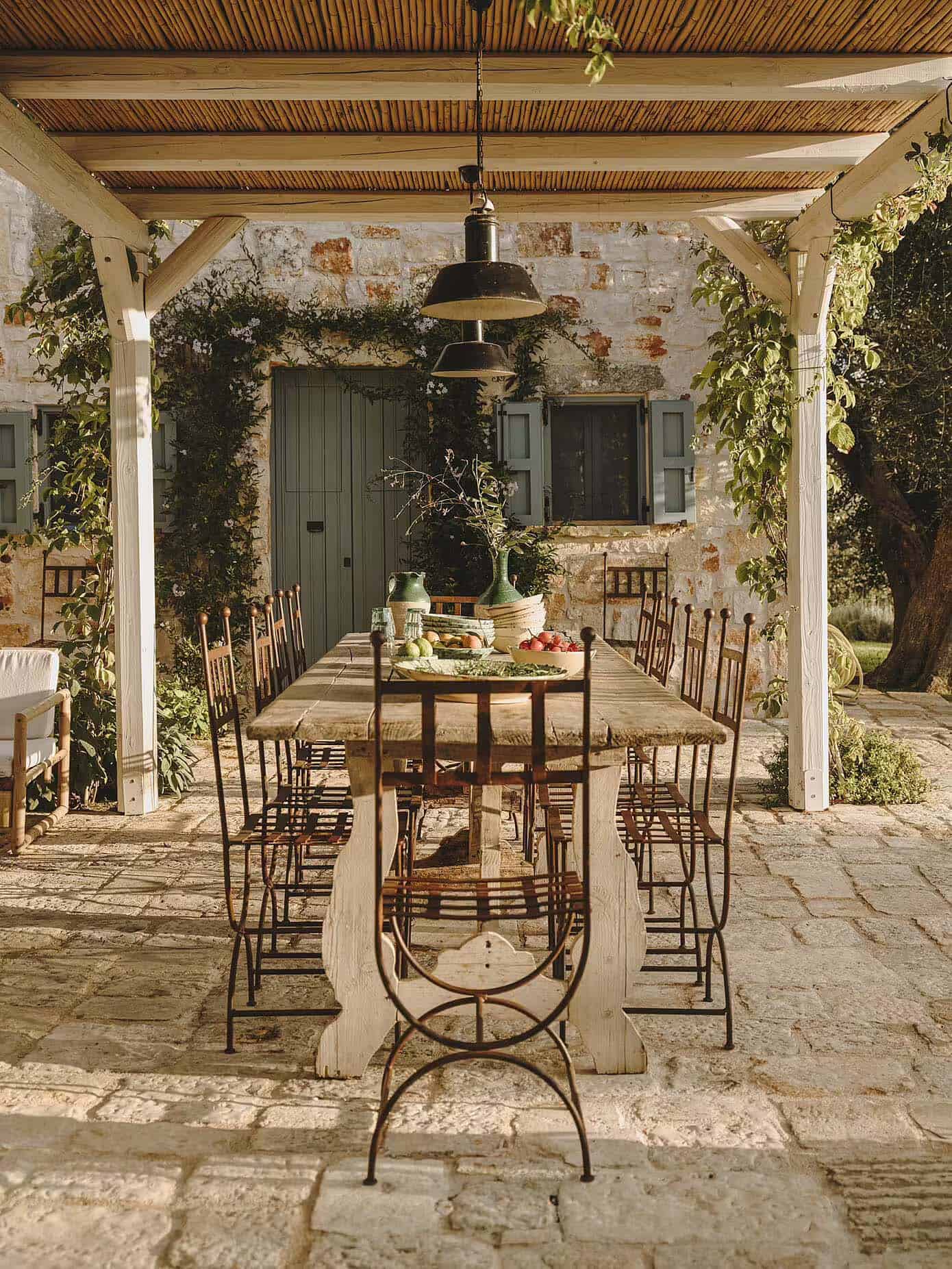 rustic stone house exterior with outdoor dining