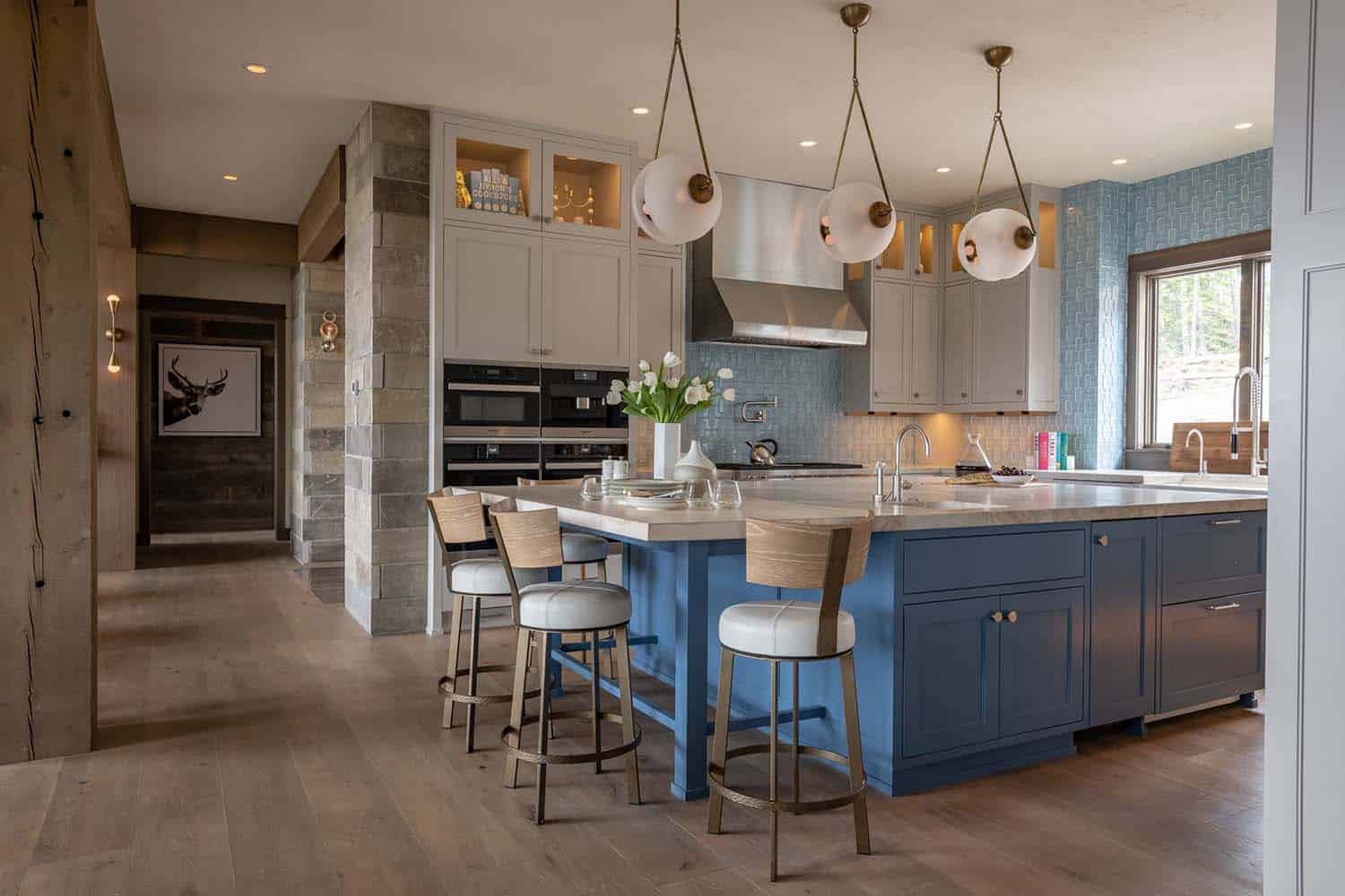 contemporary kitchen with a blue painted island
