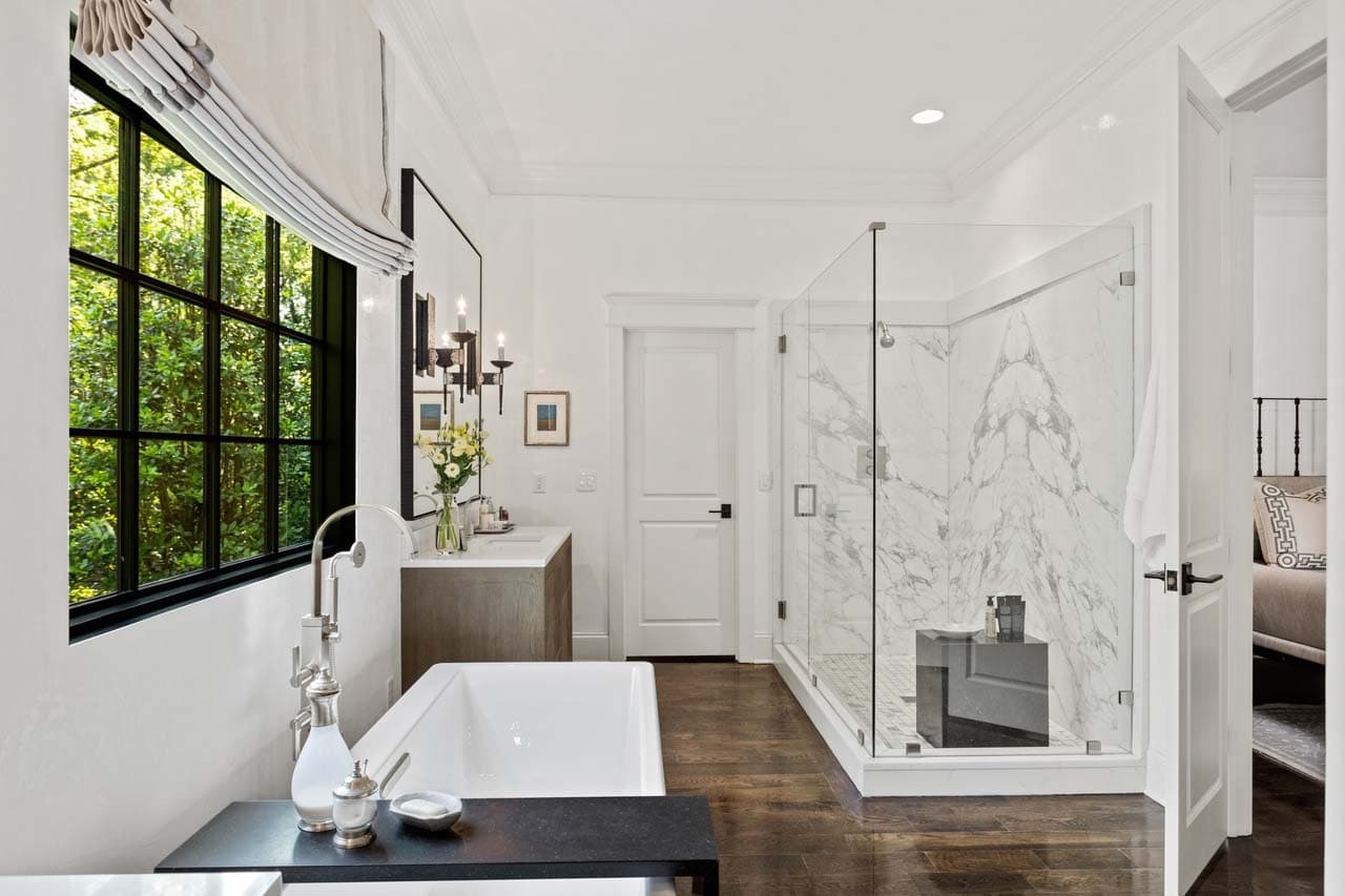 transitional bathroom with a freestanding tub and shower