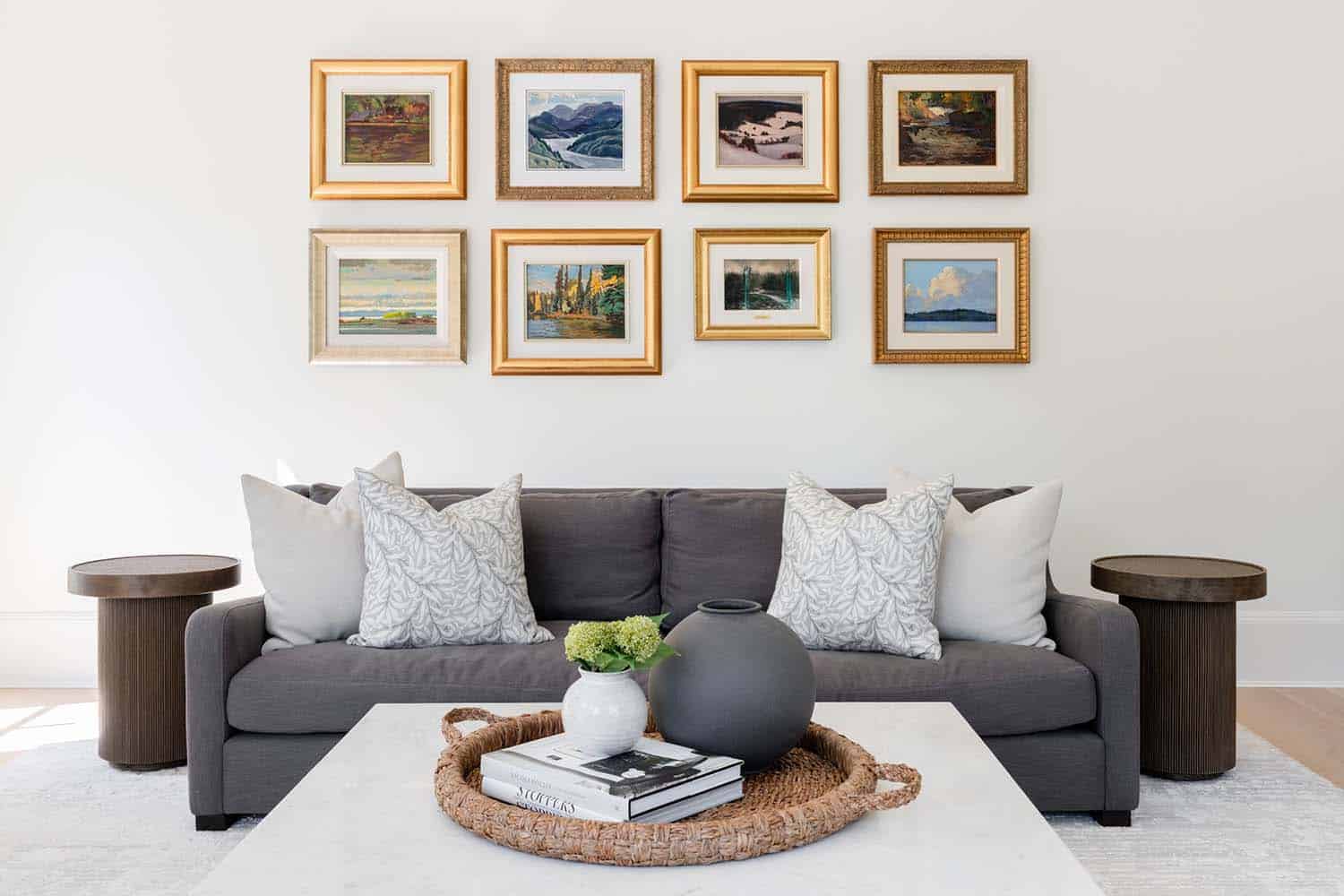 transitional family room with an art gallery wall above the sofa