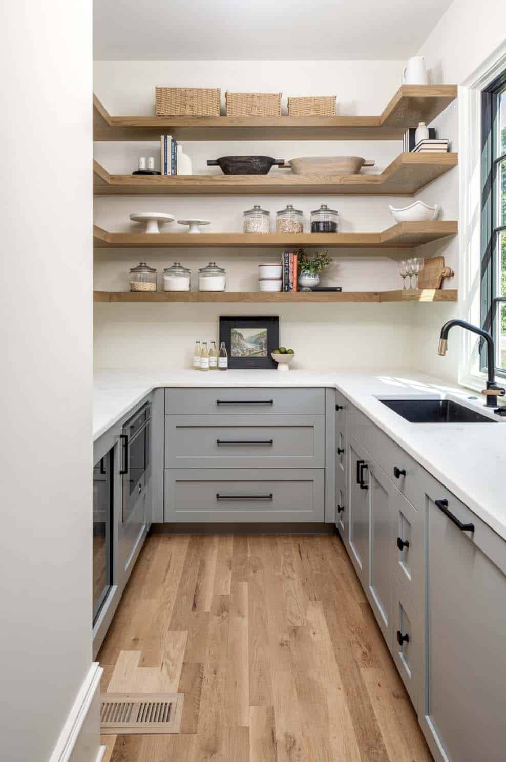 transitional kitchen pantry with gray cabinetry