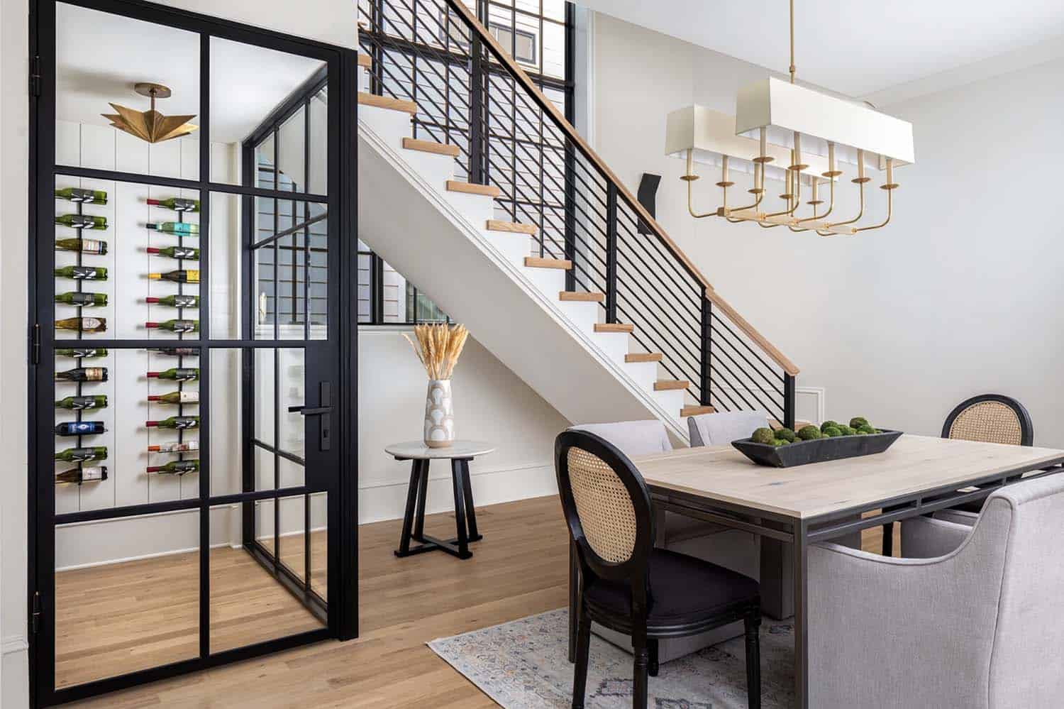 transitional dining room with wine storage underneath the staircase