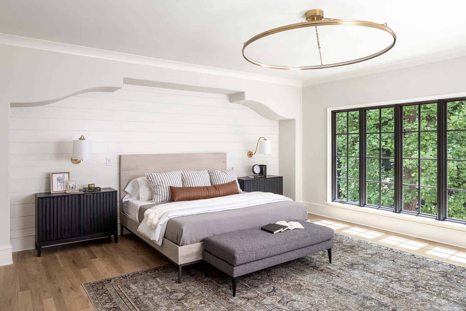 transitional bedroom with an alcove