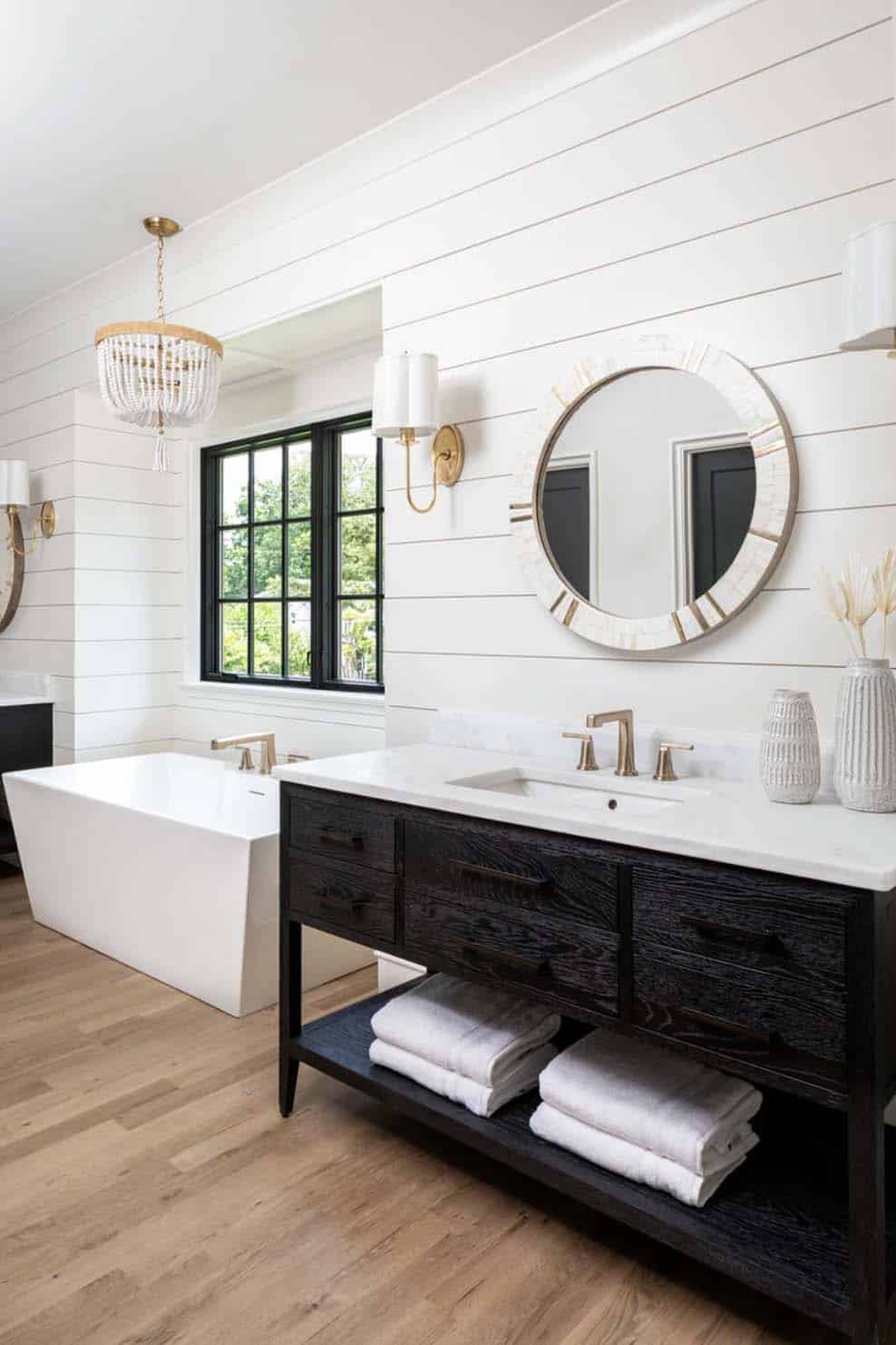 transitional bathroom with a freestanding tub