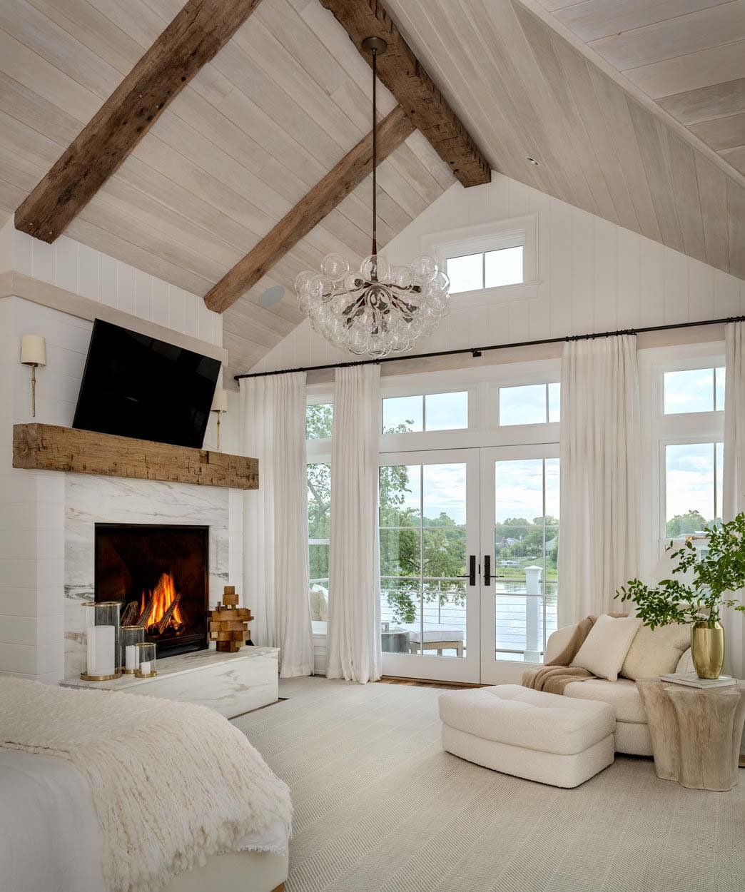 beach style bedroom with a fireplace