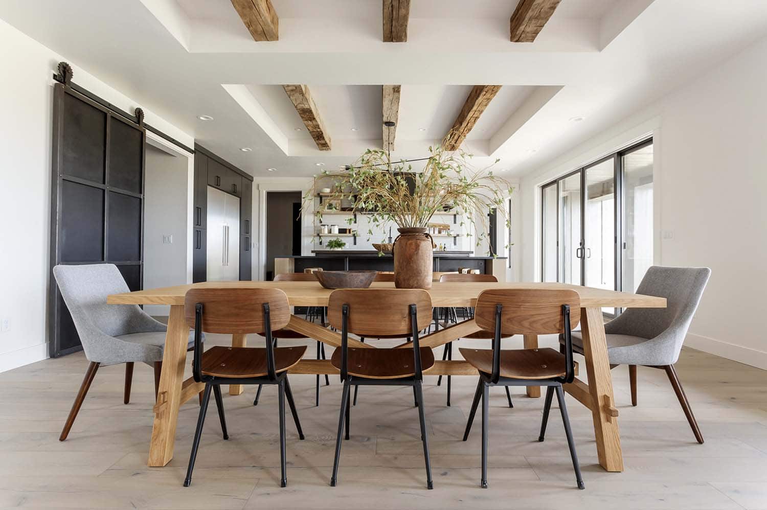 modern dining room with wood ceiling beams