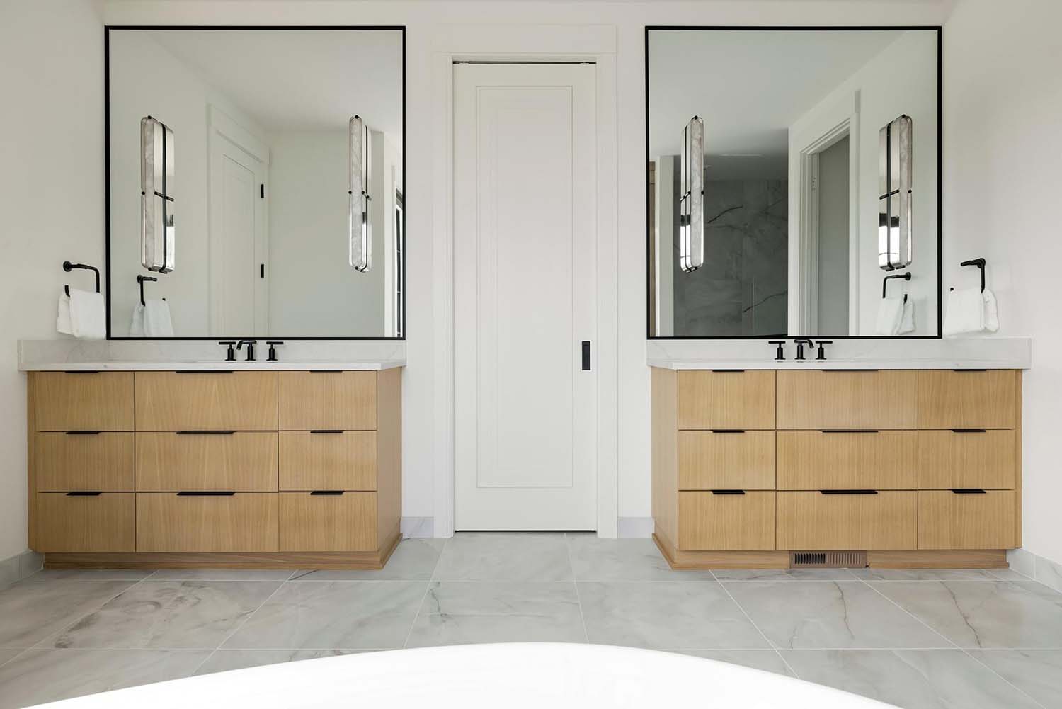 transitional bathroom with dual vanities