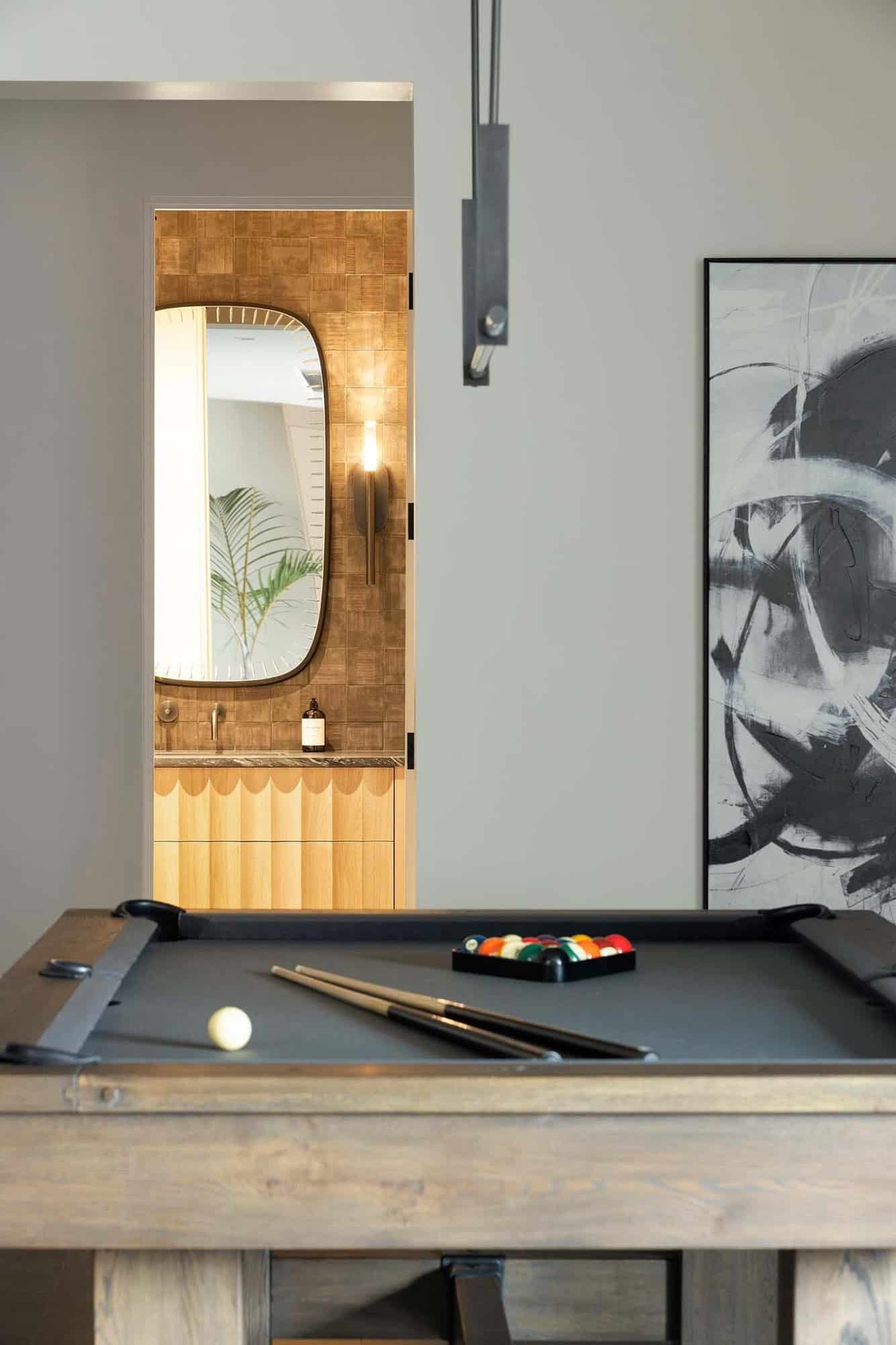 modern pool table on the lower level