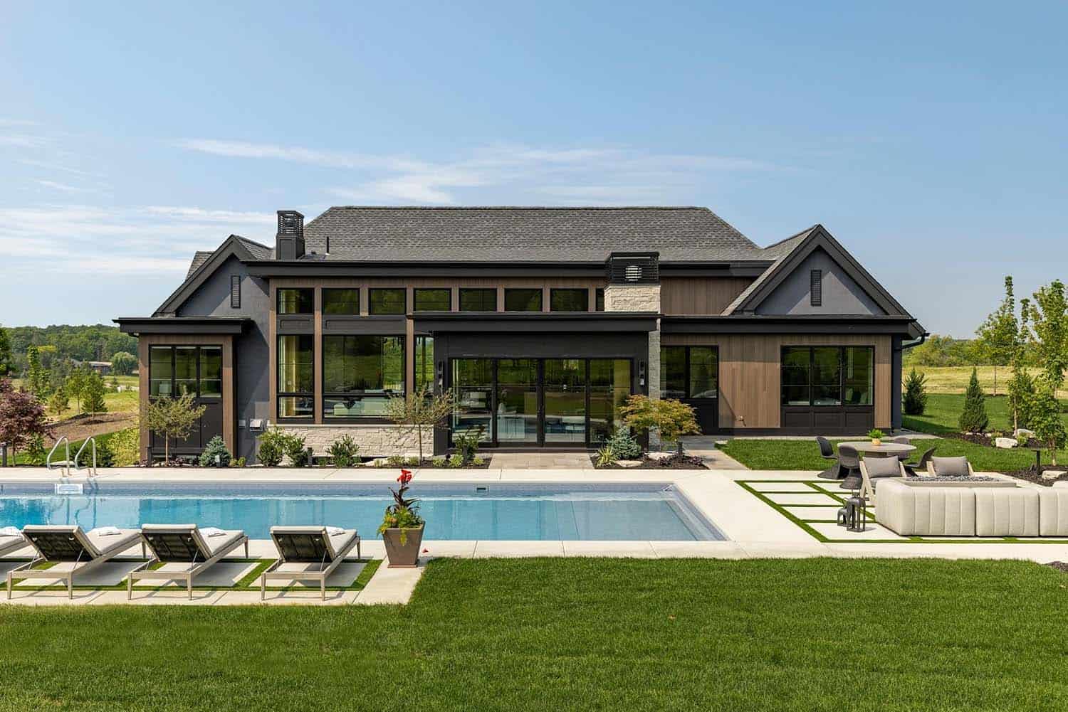 modern rambler home with a swimming pool