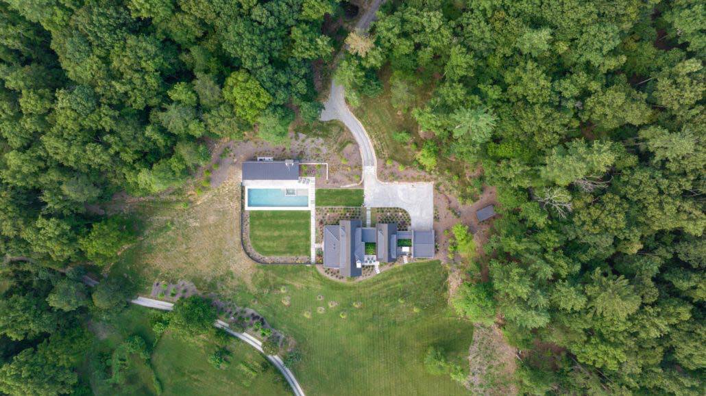 modern mountain farmhouse exterior aerial view