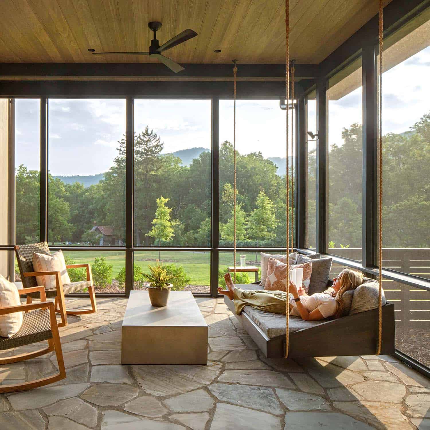 modern screened porch with a hanging daybed