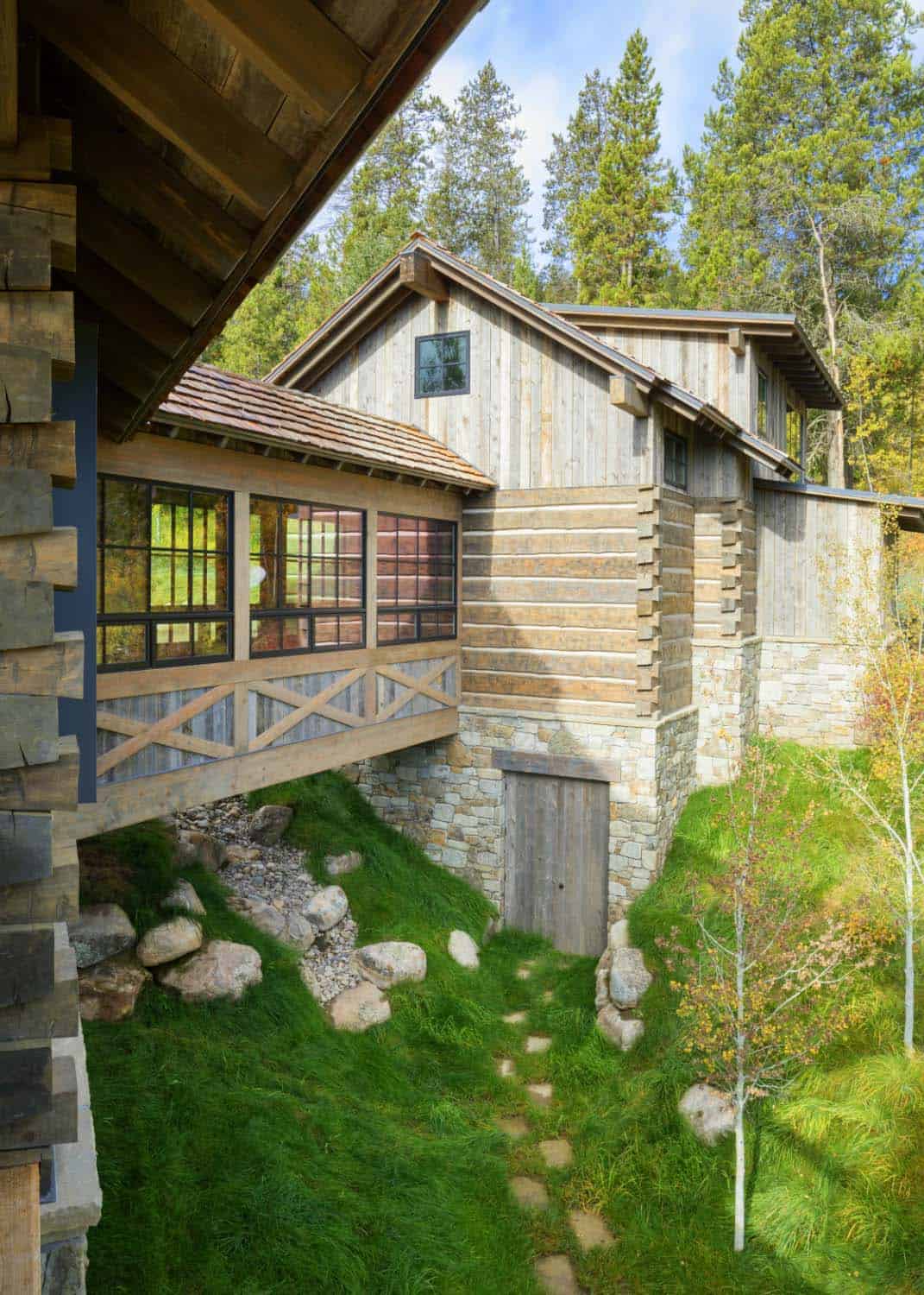 mountain modern cabin exterior with a connector bridge
