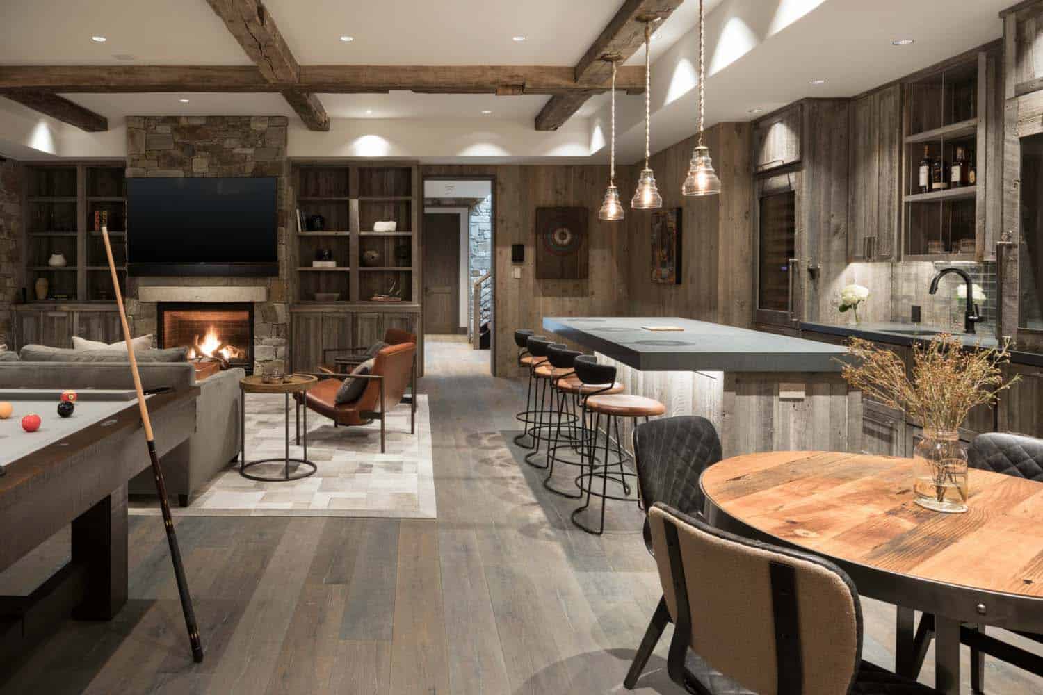 mountain modern lower level family room with a home bar