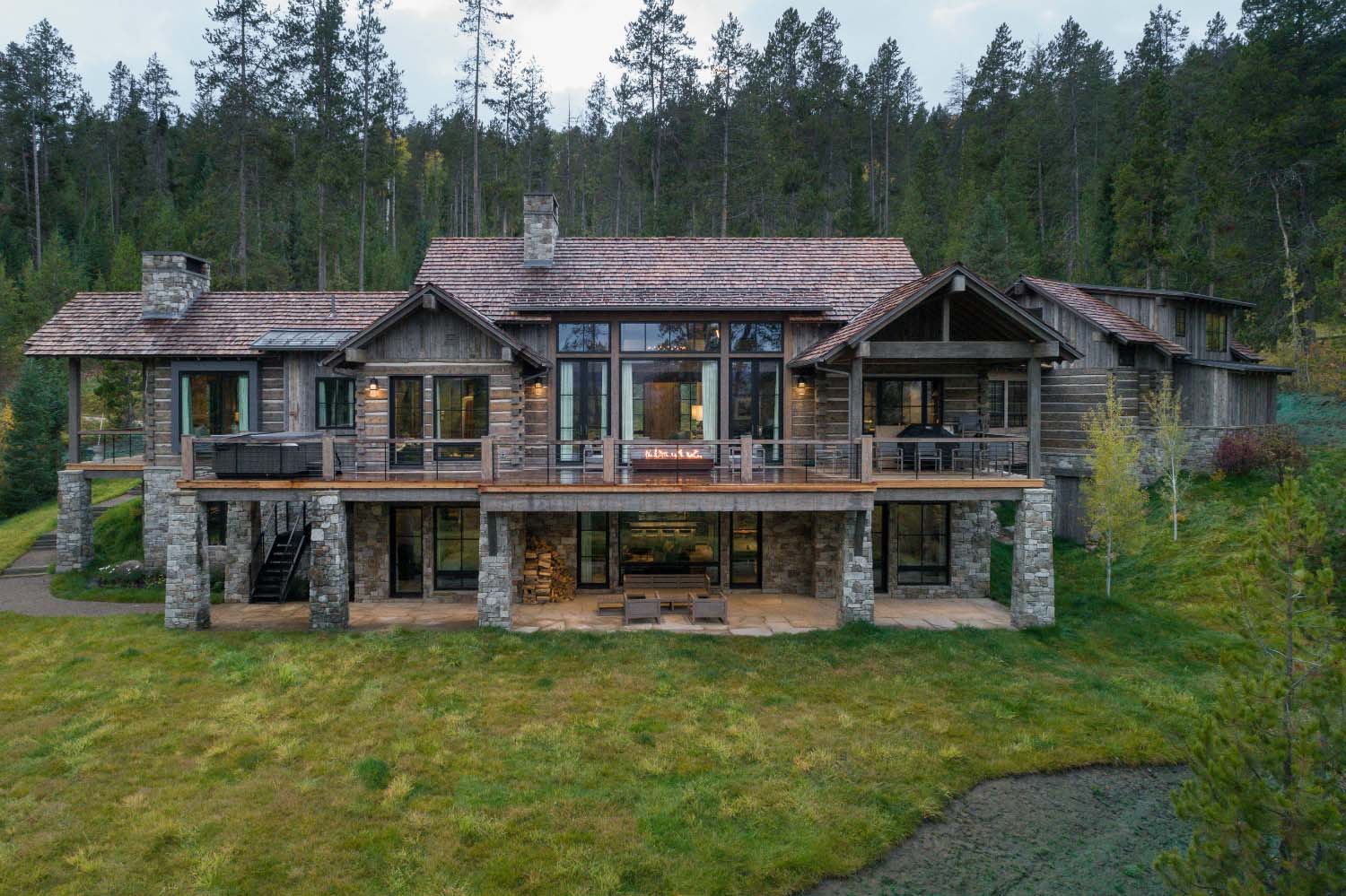 mountain modern cabin retreat exterior backyard view