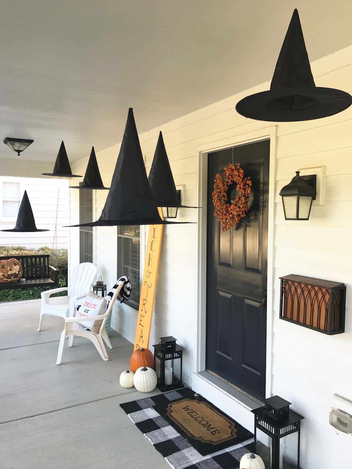 hanging witch hats on the front porch for halloween