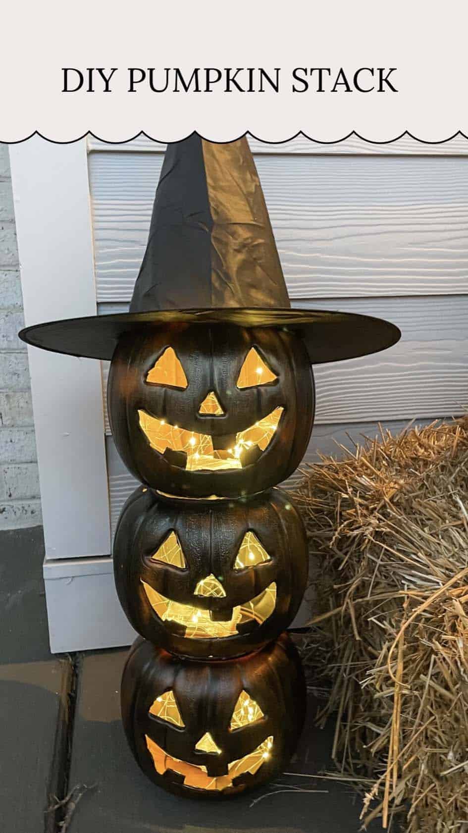 diy stacked pumpkin with a witches hat and string lights