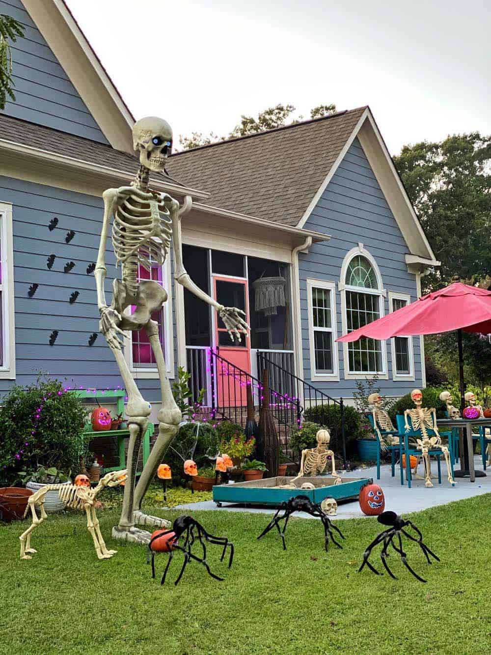 Halloween decorated yard with zombies and skeletons