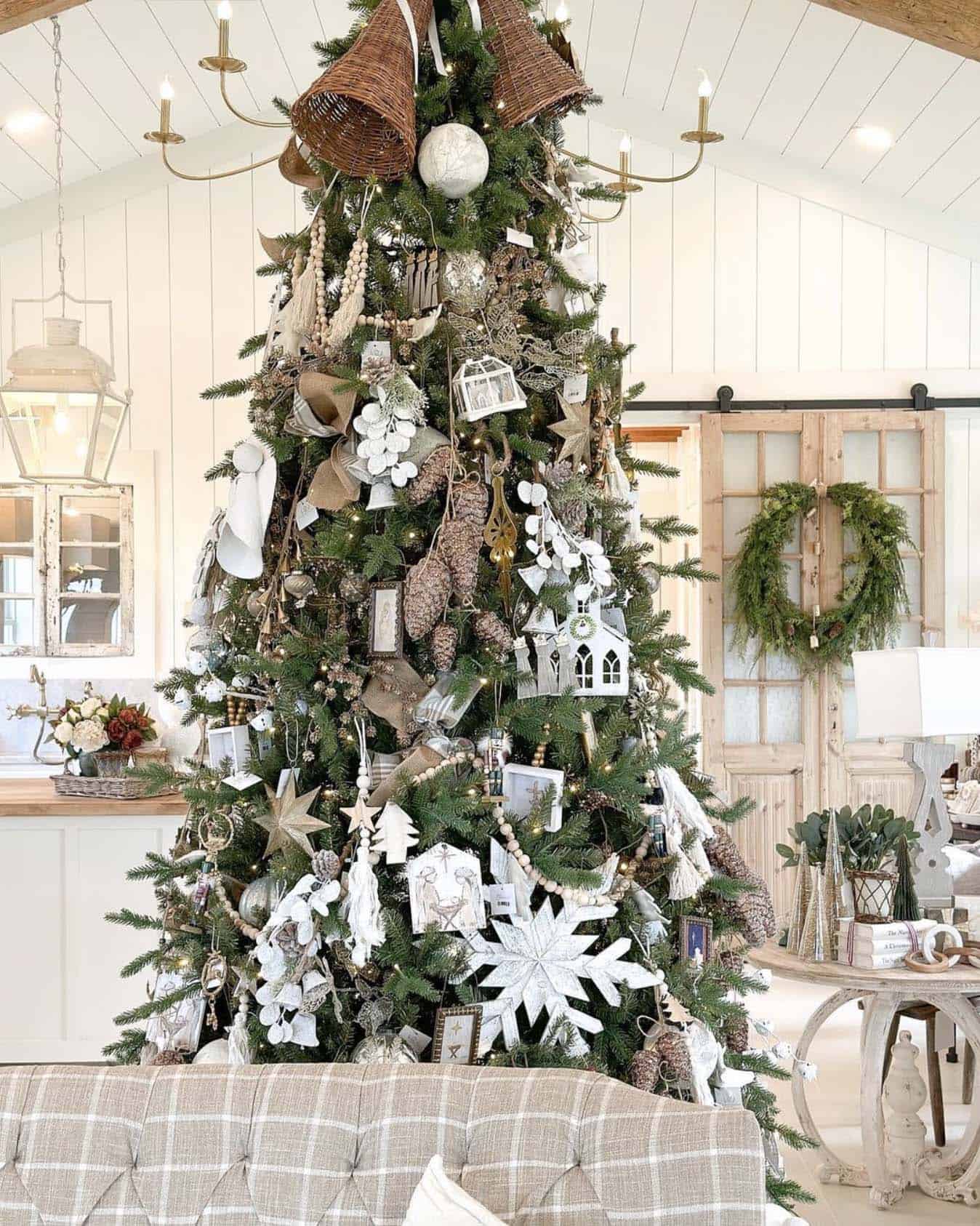 rustic Christmas tree with nativity ornaments, snowflakes and pinecones