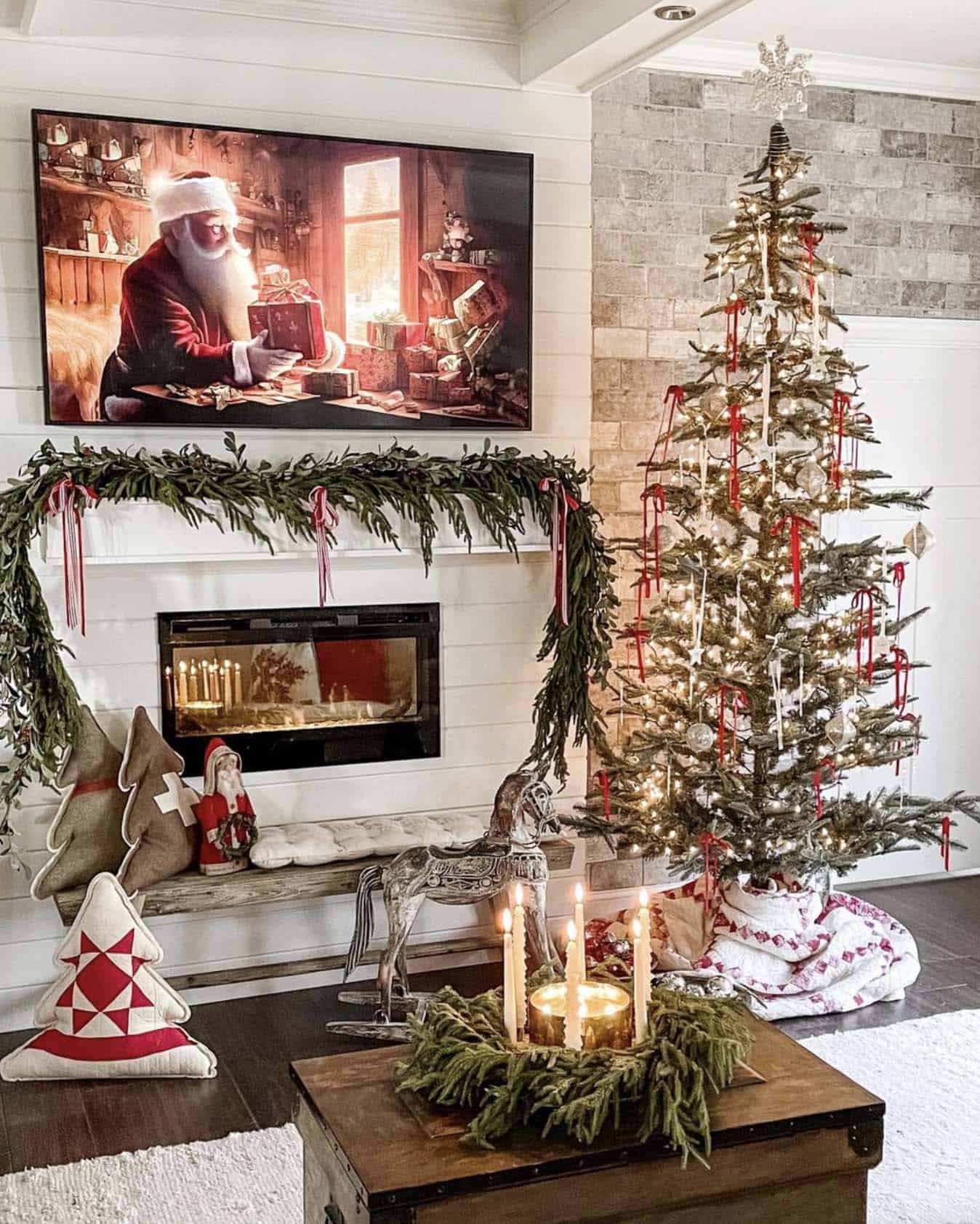 living room fireplace mantel decorated with garland and a Christmas tree
