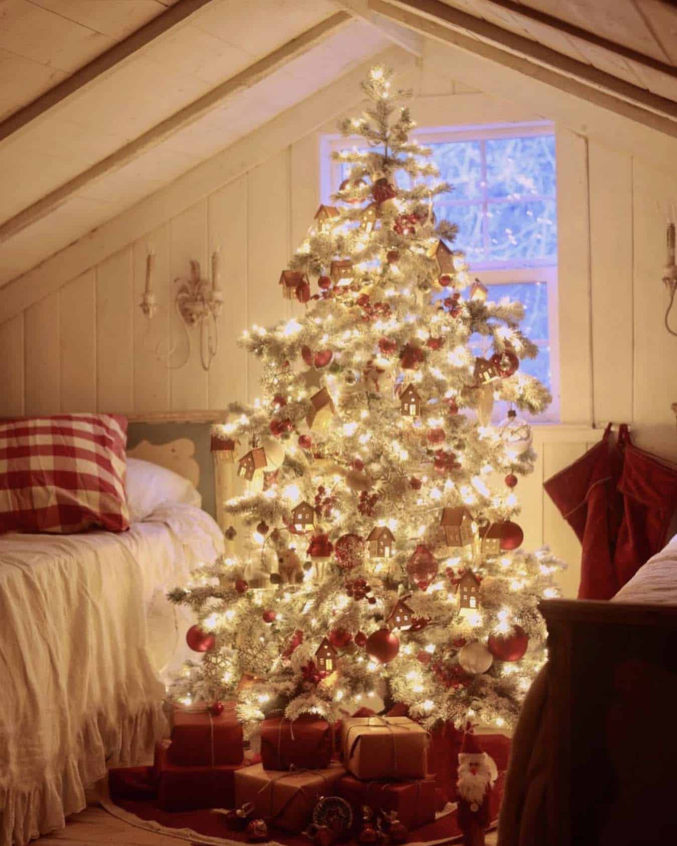 red and white and snow-covered nostalgic tree in an attic bedroom