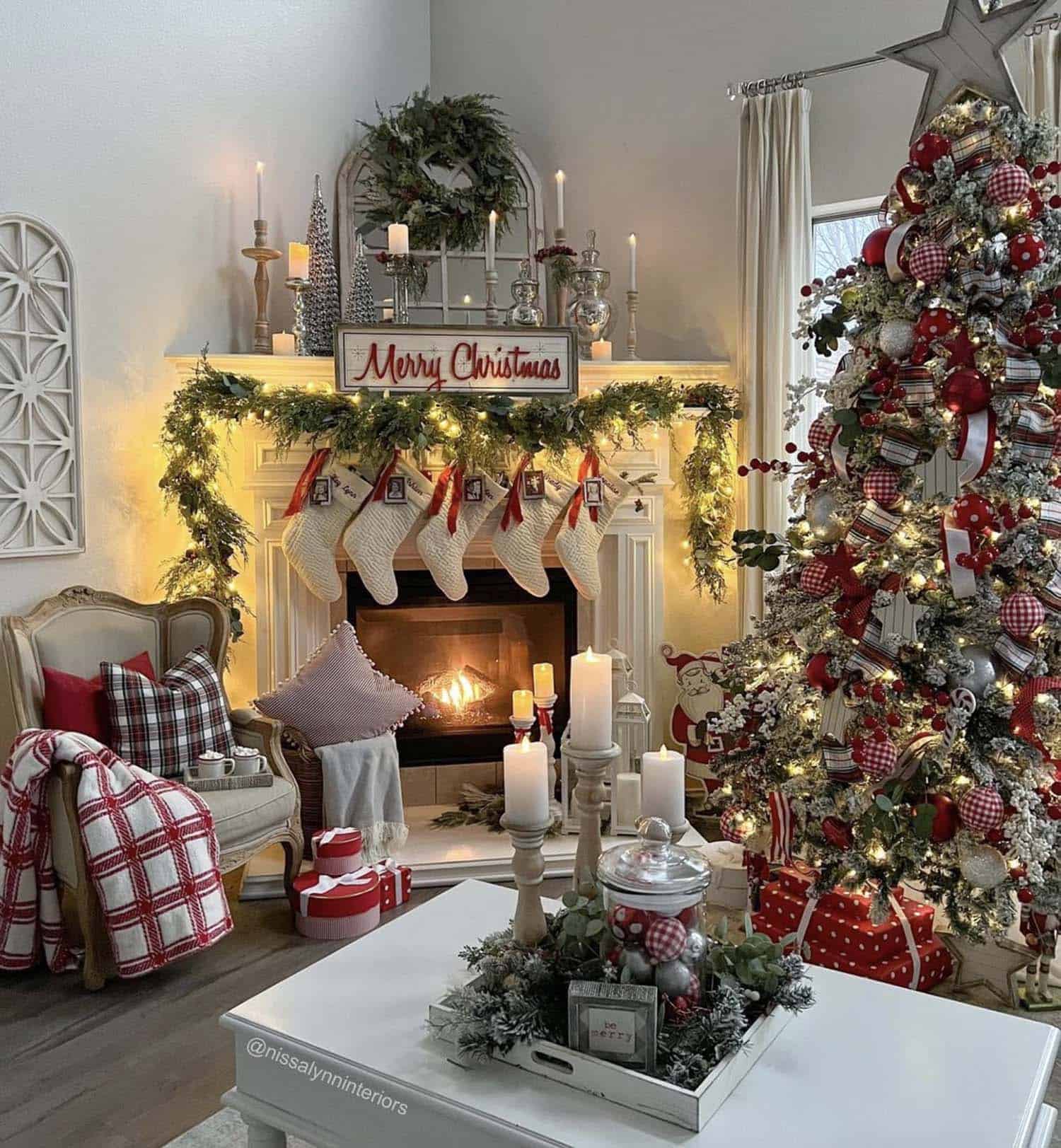 Christmas living room with stocking hung on the fireplace, garland and a tree